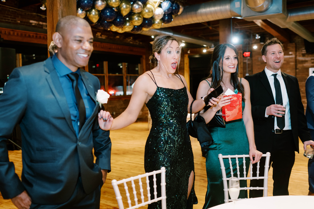 Wedding guests watching a card routine