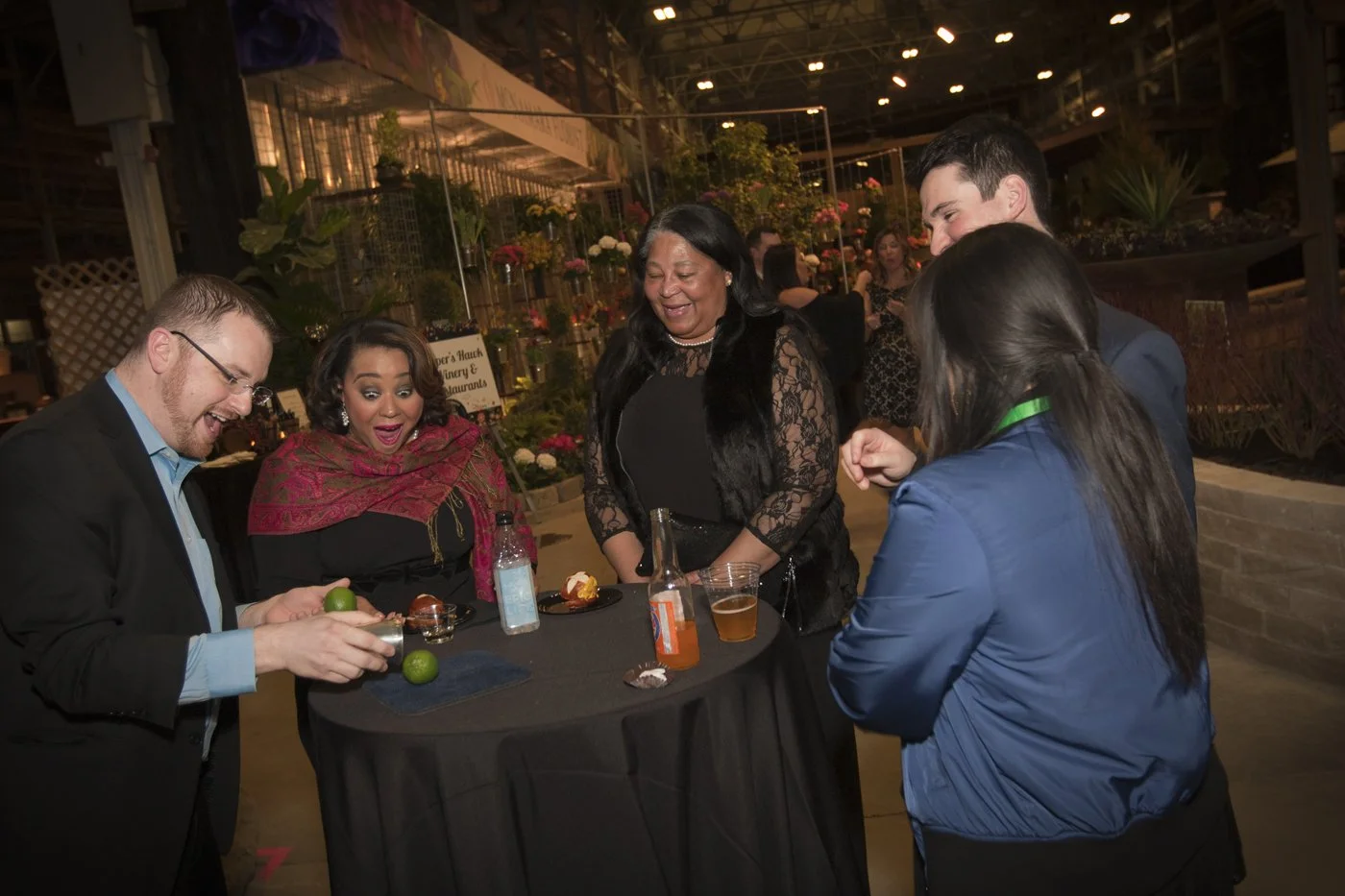 Caleb performing for guests at an indoor corporate event