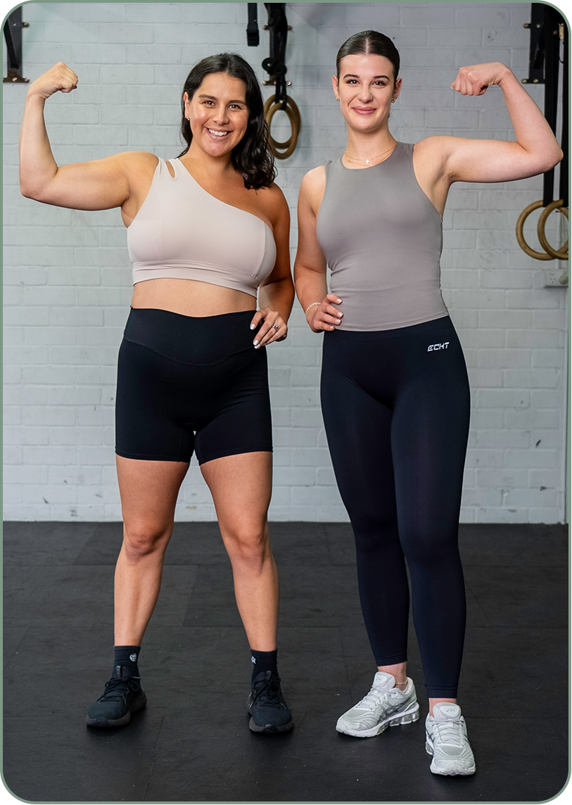 HERPhase Emma Scrench Flexing Bicep With Client In Gym