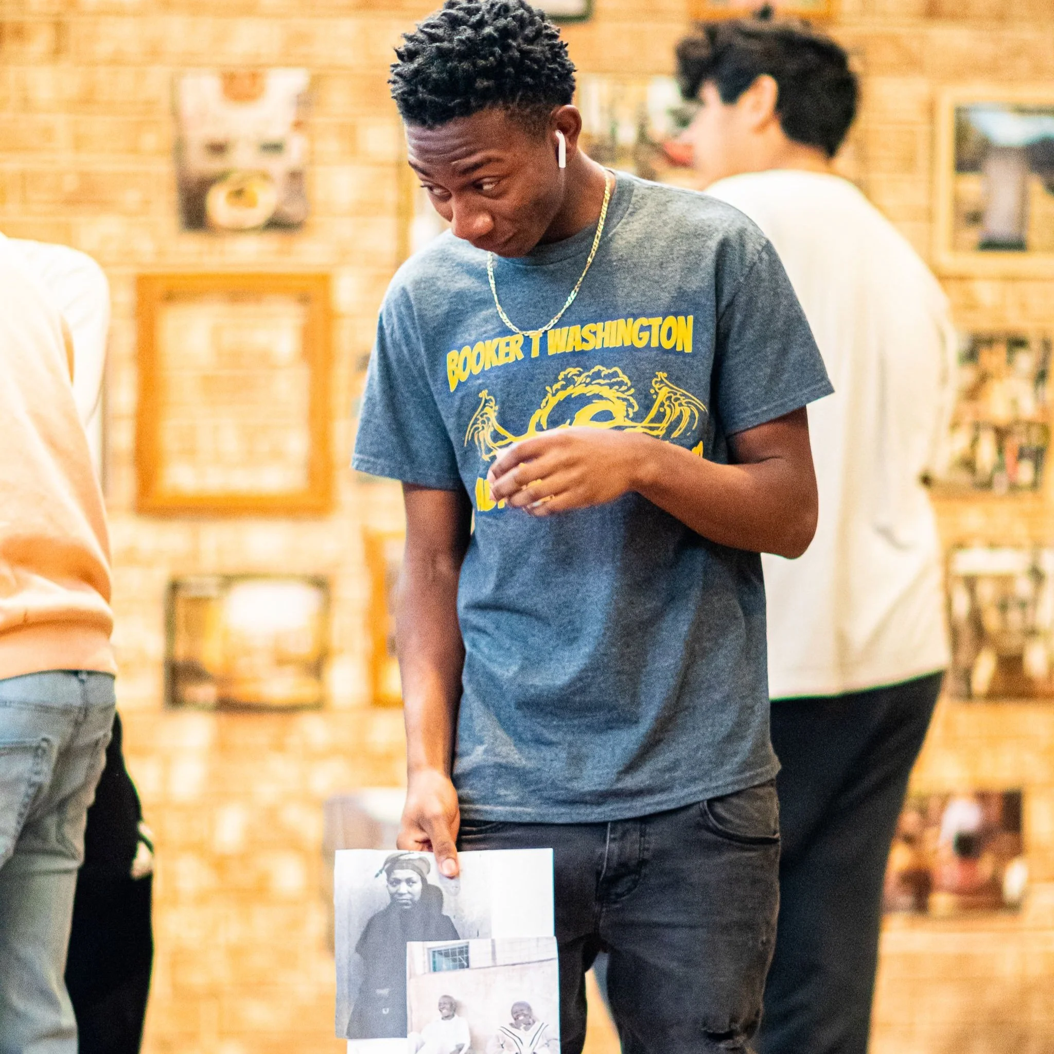 Young man participating in collage making.