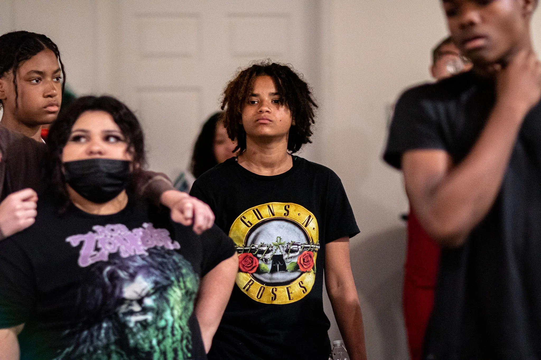 Boys and girls engage in artistic conversation. 