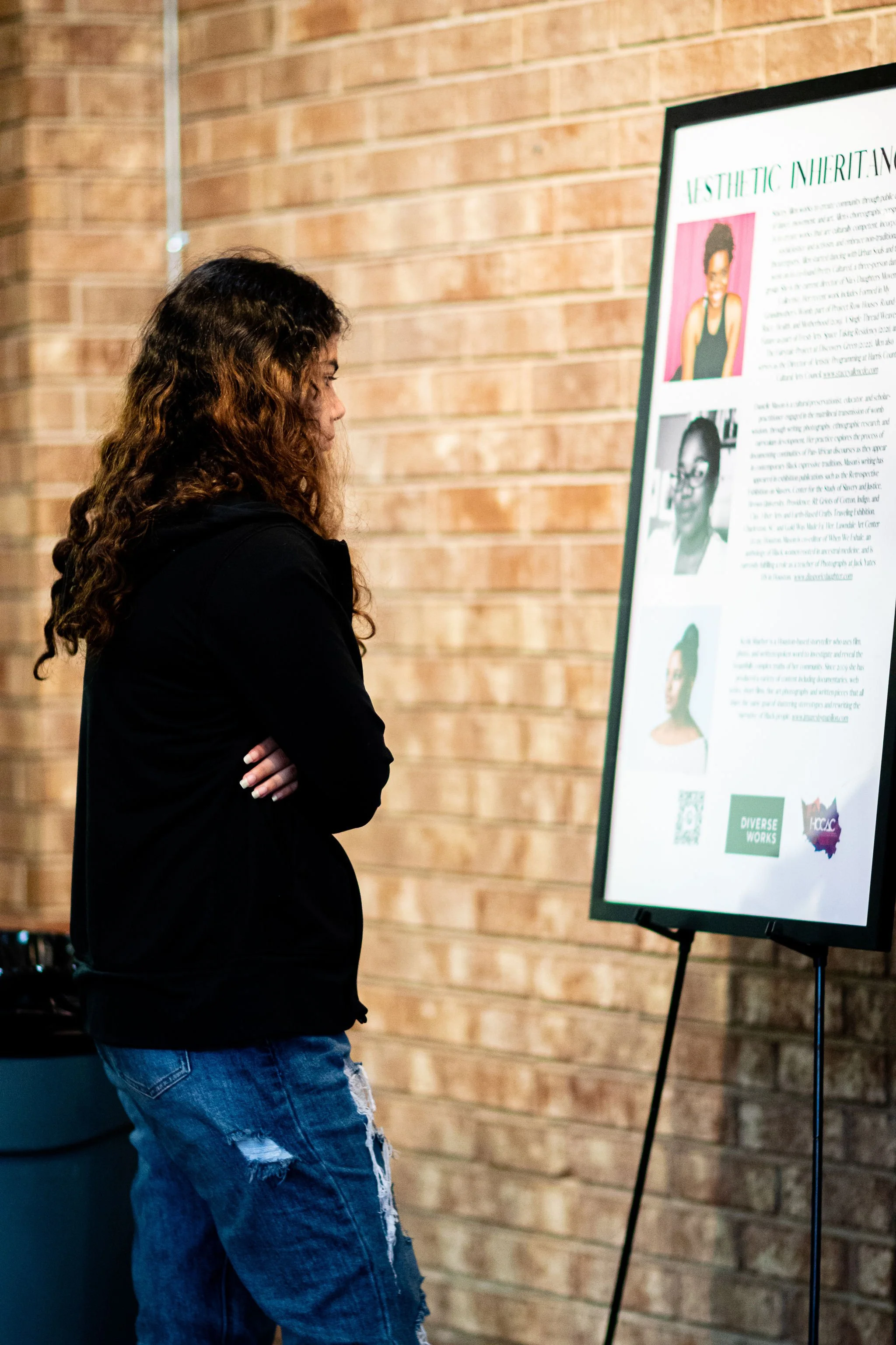 student reading artist statement from Aesthetic Inherences by Stacy Allen.