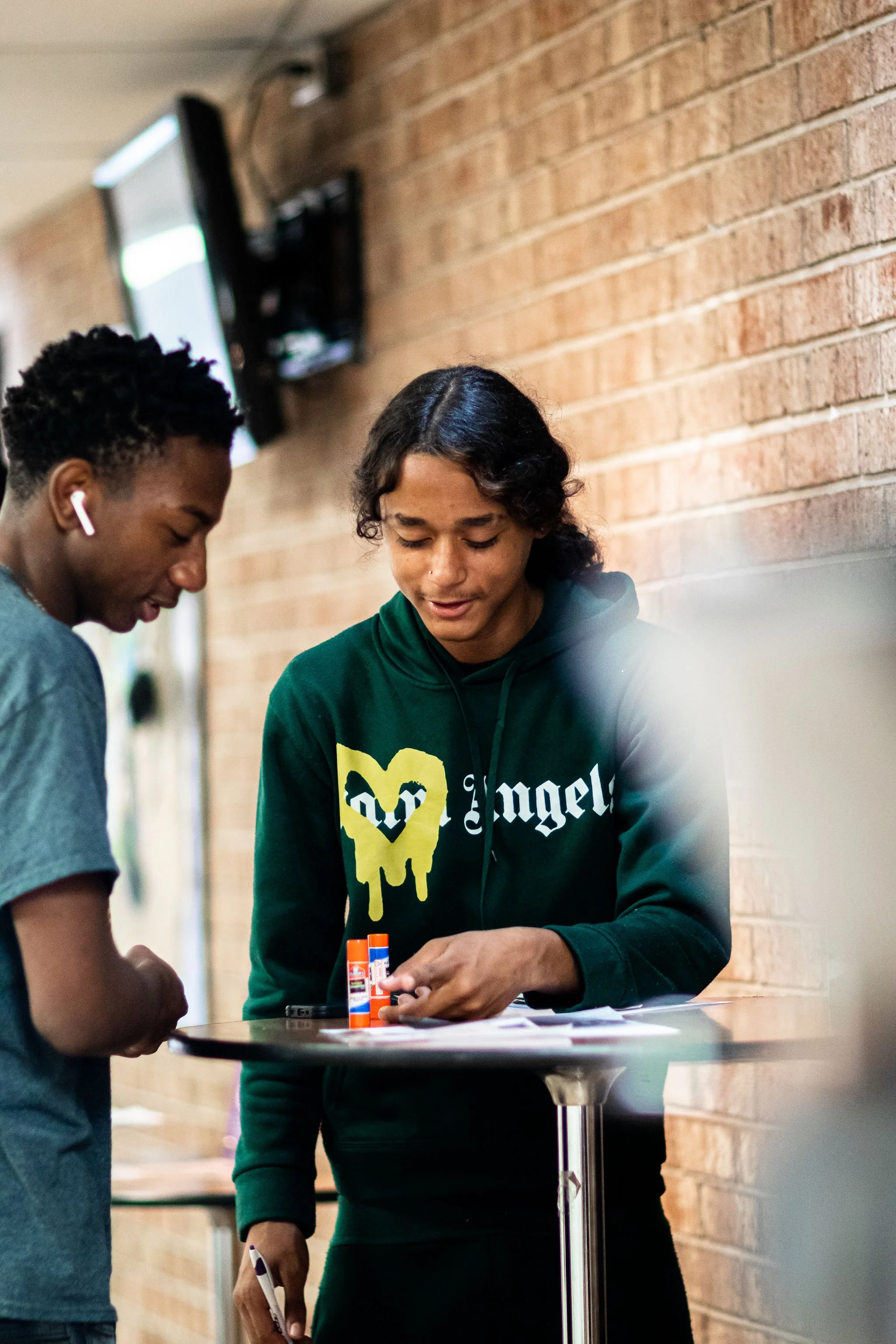 Boys talking amongst themselves. 