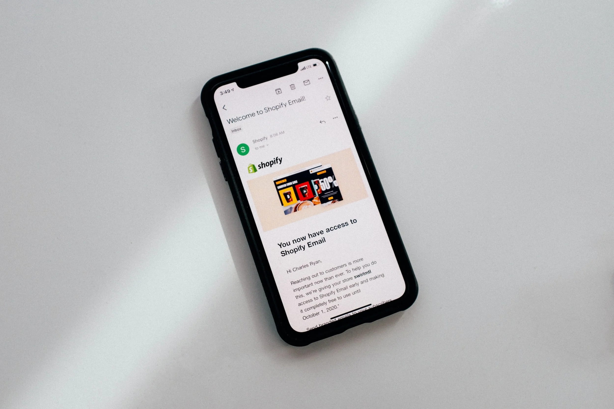 Smartphone displaying an email from Shopify welcoming the user and confirming access to Shopify Email.