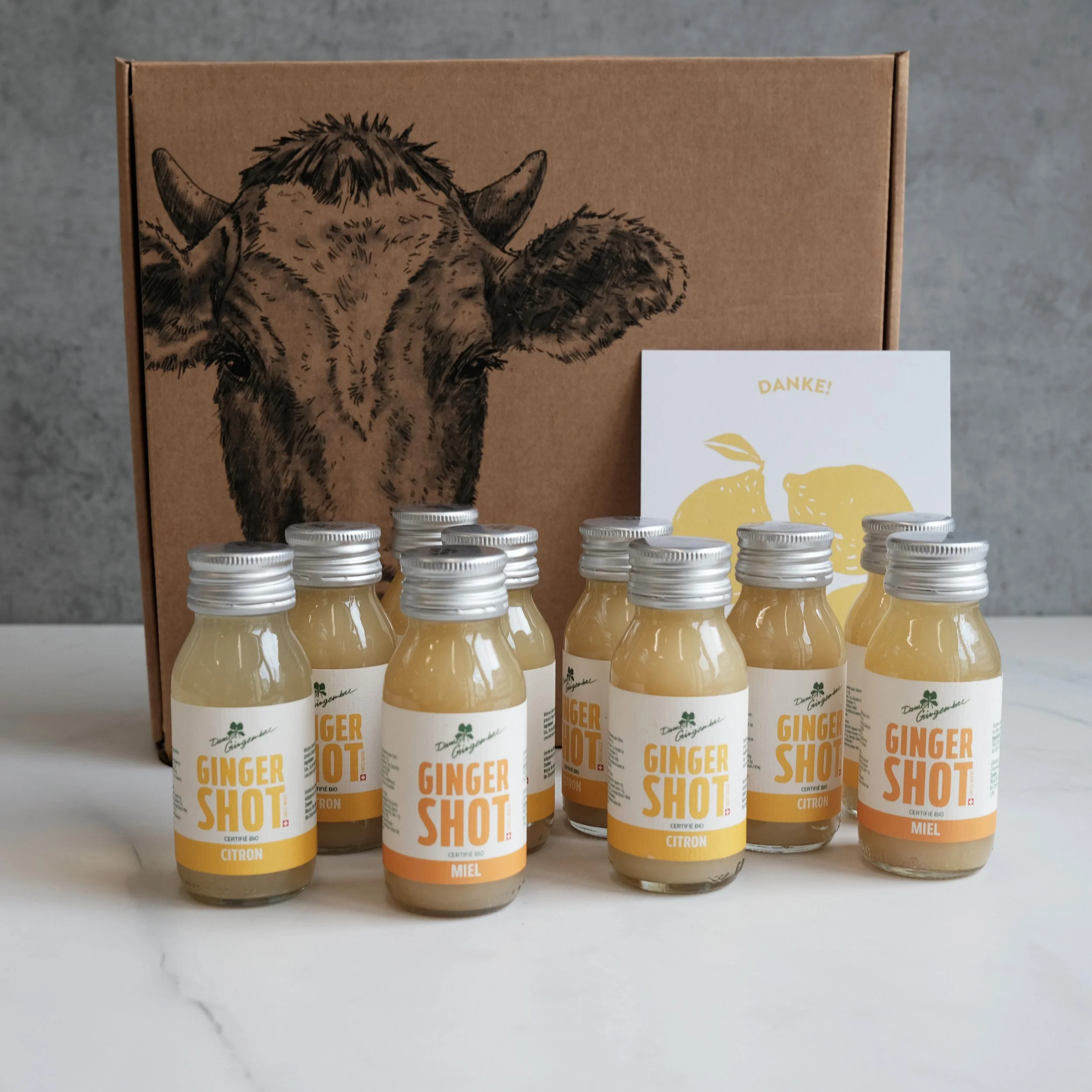 Kleine Box mit Ingwer-Shots für einen Energiekick.