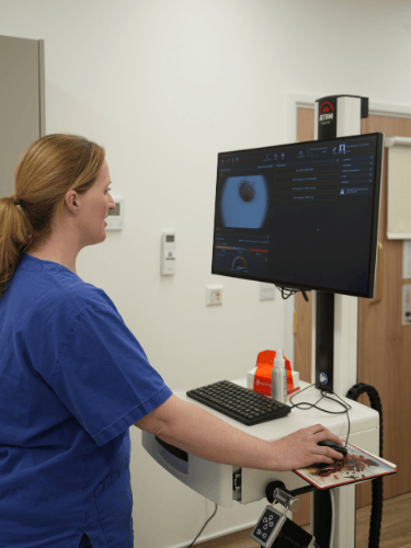 A skin cancer nurse at Apex Skin Clinic at Berkshire Grove Hospital performing advanced mole mapping using FotoFinder technology, reviewing high-resolution skin images on screen.