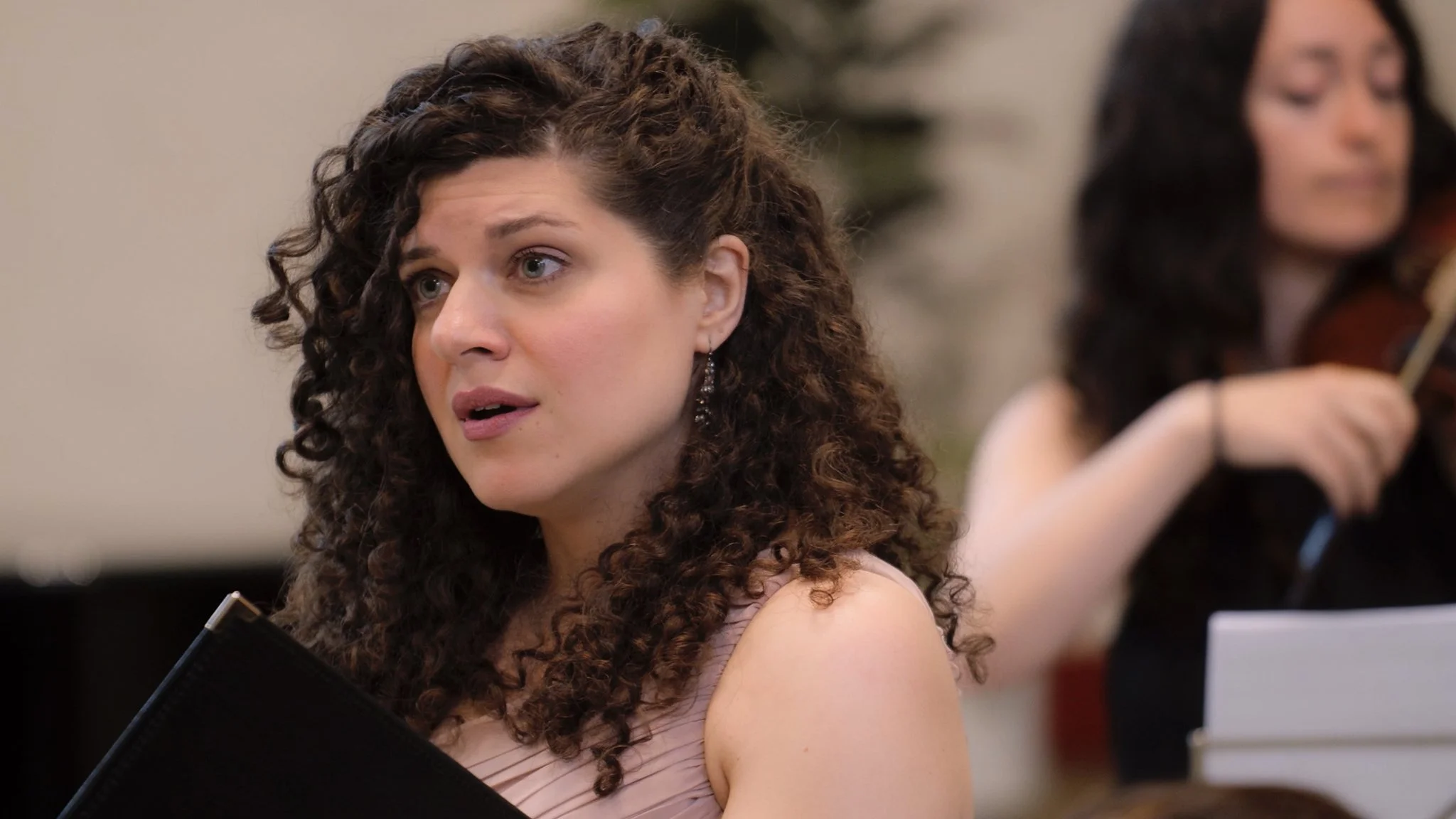 Singer performing with an ensemble