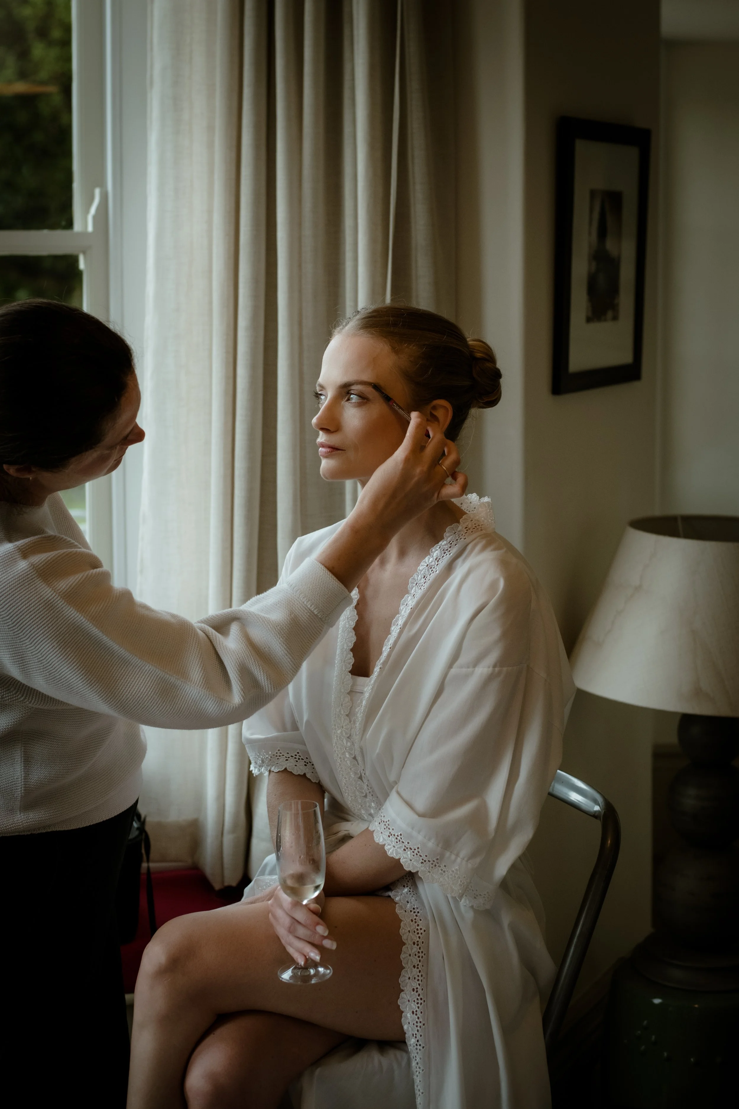 Luxury bridal make up and hairstyling by Nandi Kai for a bride preparing her wedding day in Cornwall.