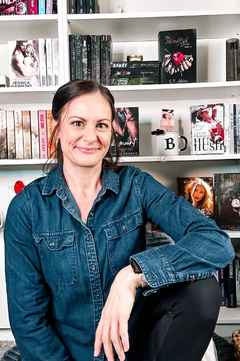 Jenn of Virtually Jenn smiling in a denim shirt.