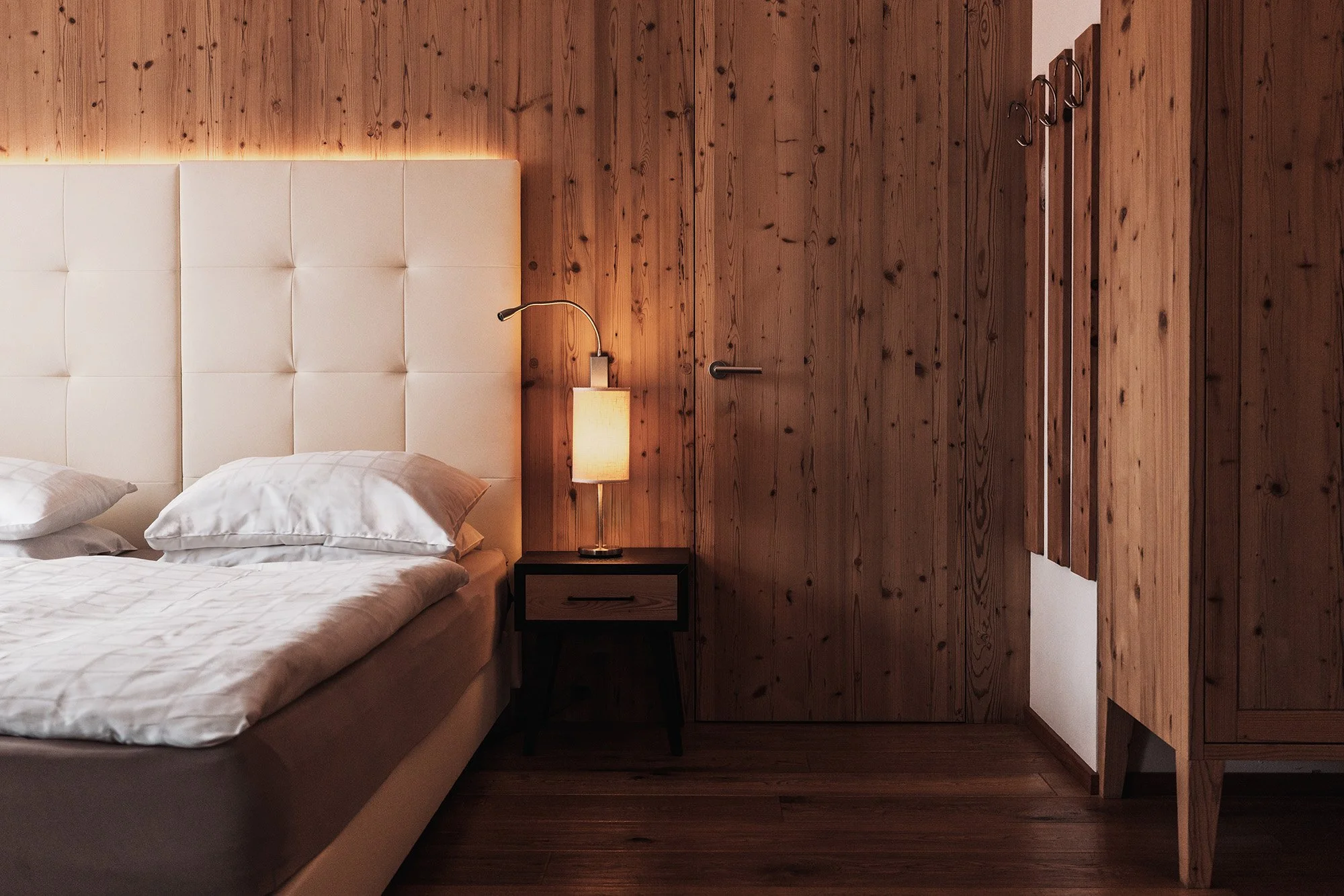guest room in soleil alpine lifestyle hotel, with low, warm lighting