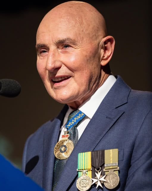 Professor Heggie smiles while wearing his service medals.