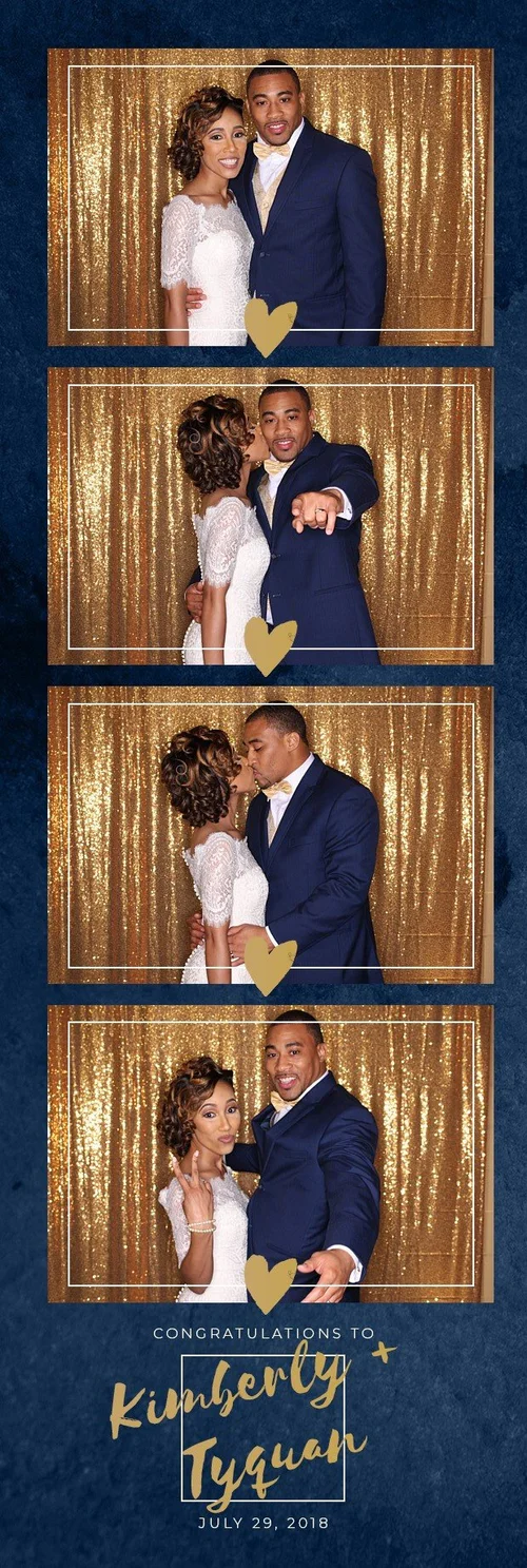 Couple at their wedding with a navy and gold print design