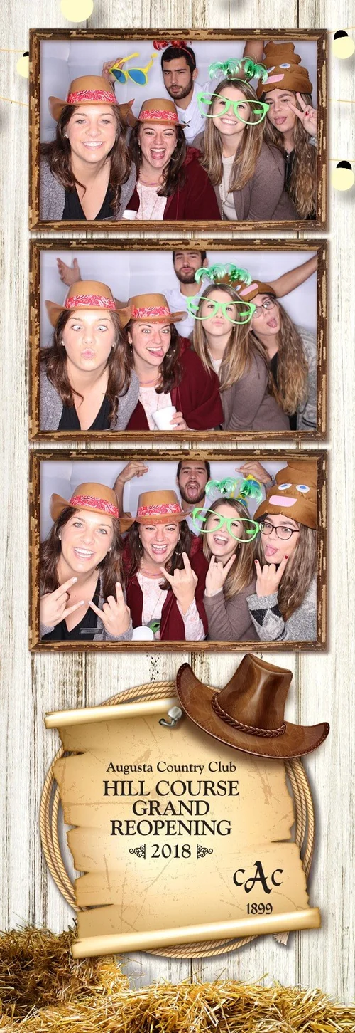 Group of guests posing with hats and glasses in a photo booth