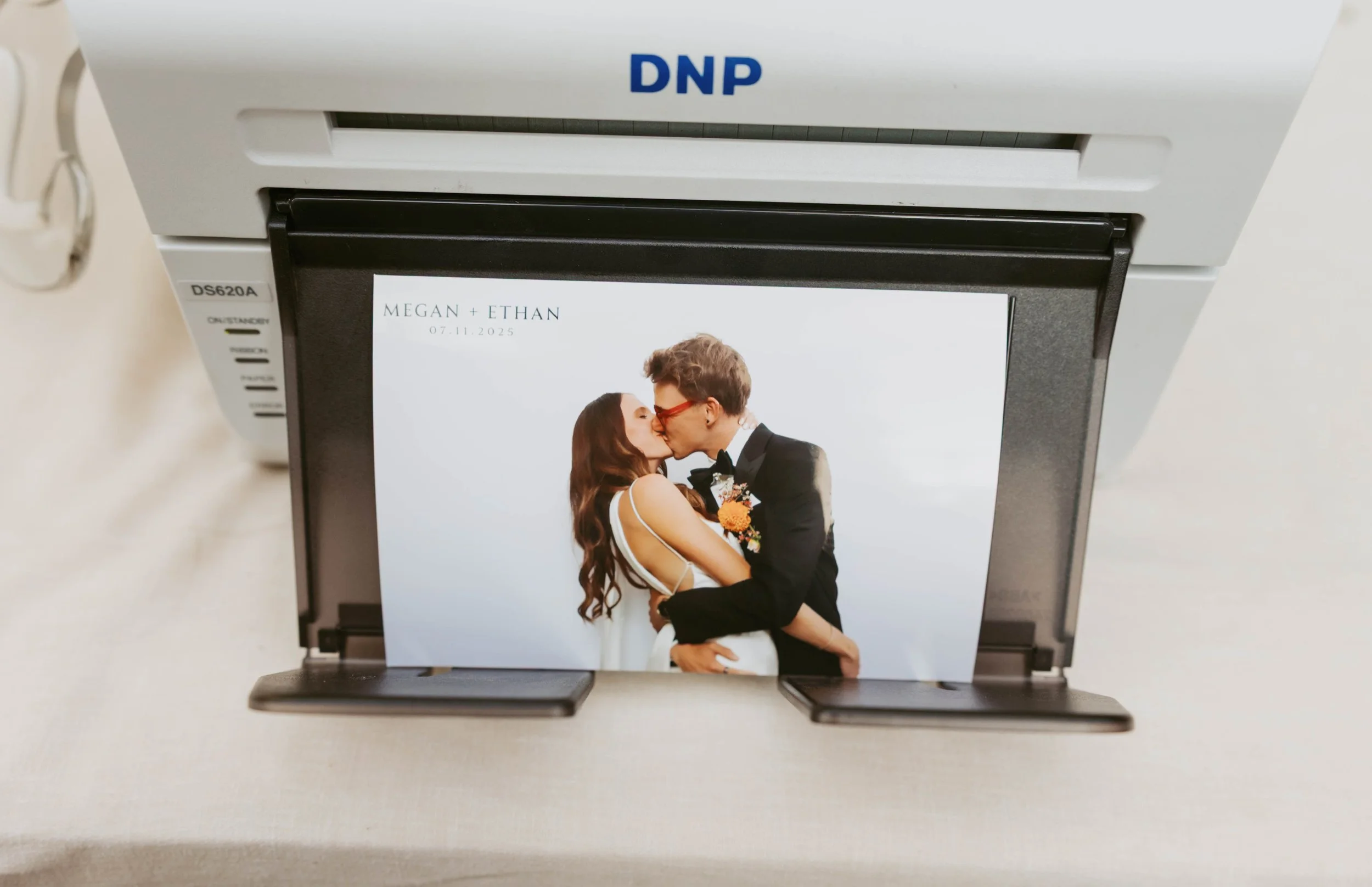 Picture printed of bride and groom kissing.