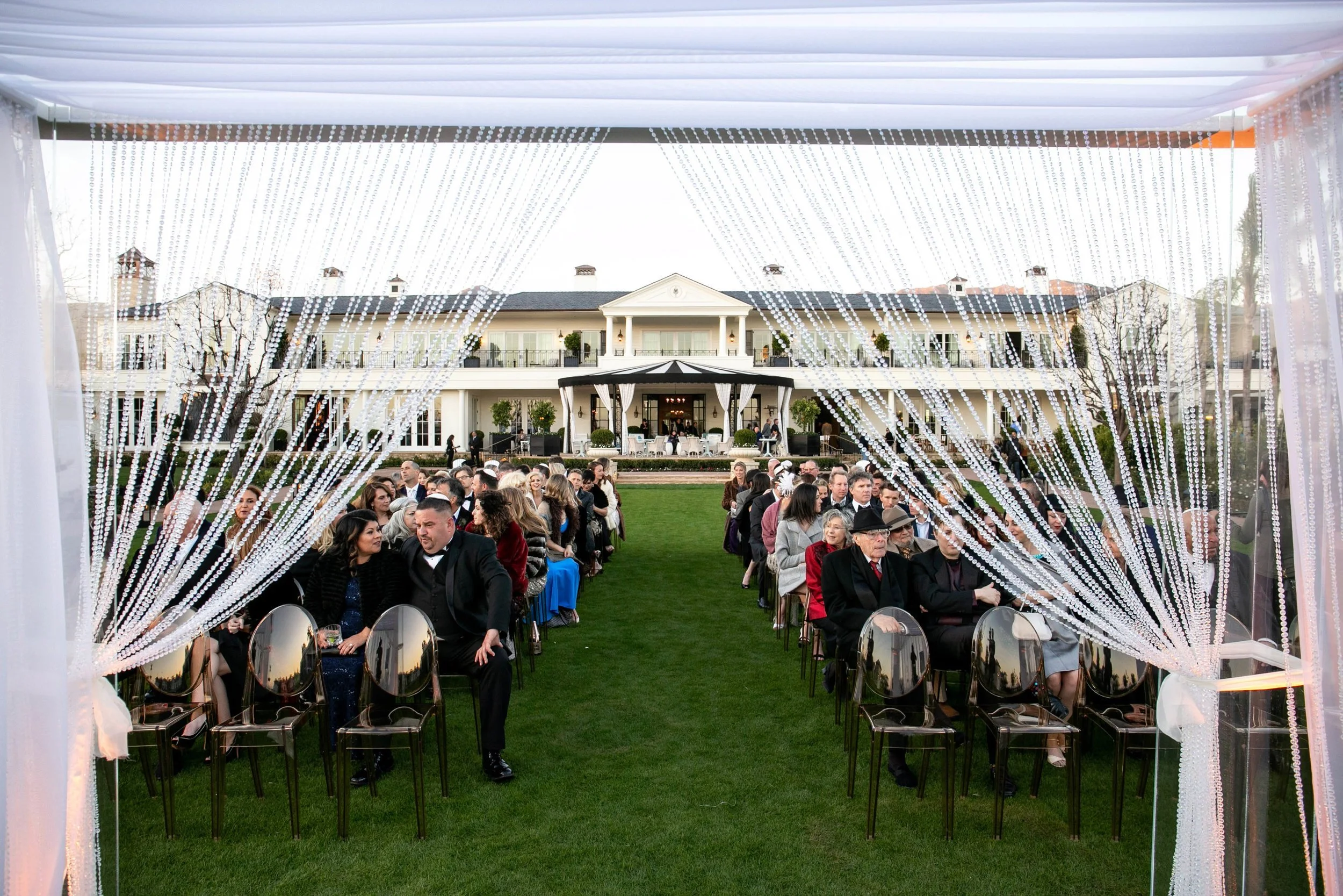 Outdoor ceremony set up with string pearls