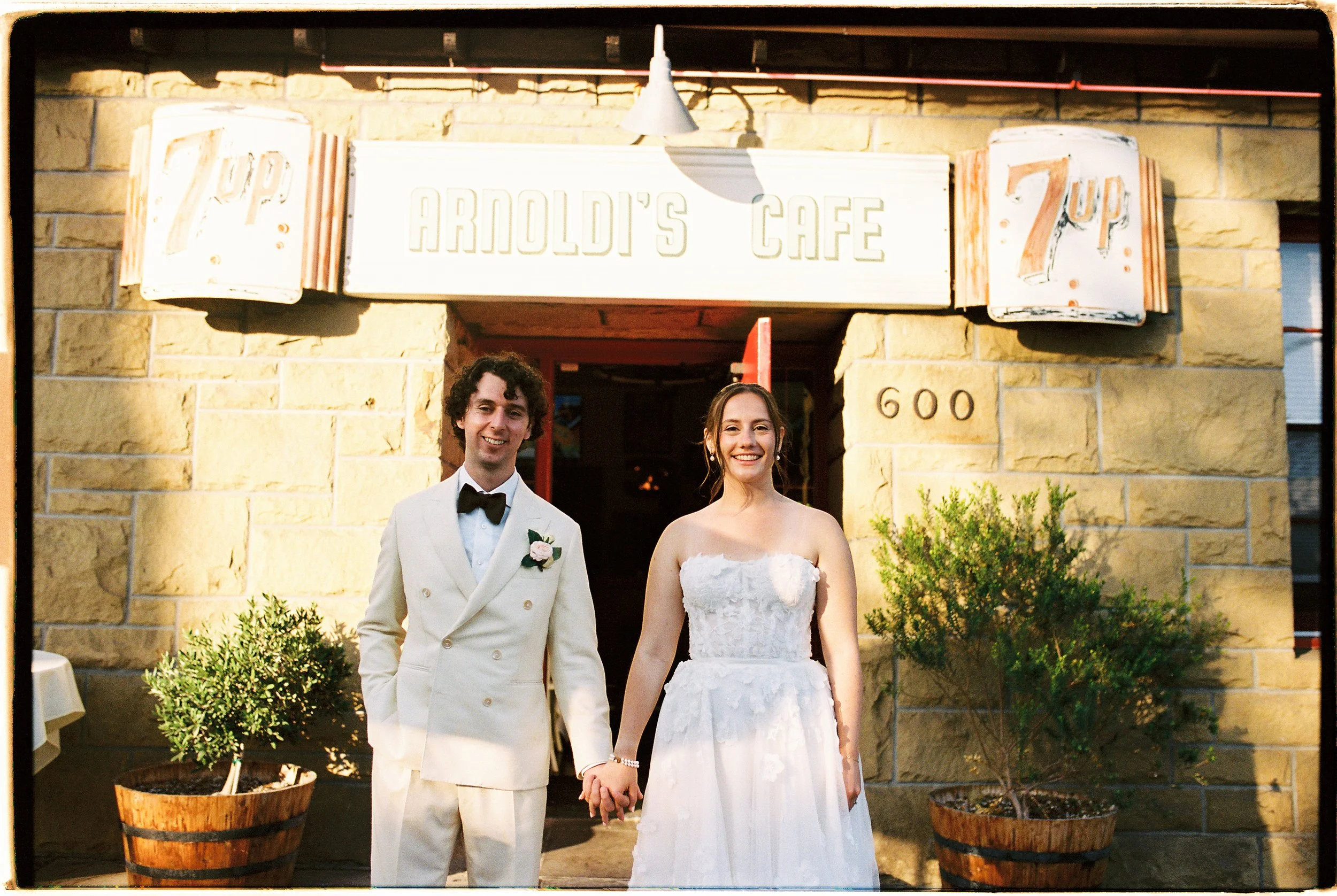 Couple in front of Arnoldi's Cafe