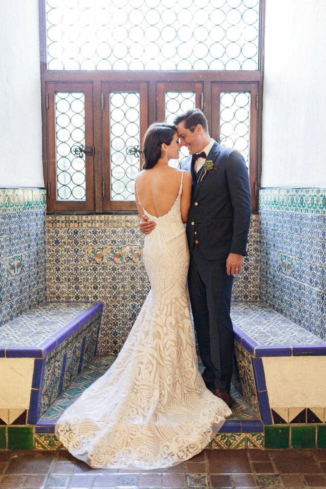 www.santabarbarawedding.com | Kaitie Brainerd | Santa Barbara Courthouse | Blush by Hayley Paige | Indochino | Bride and Groom Share a Moment at the Courthouse