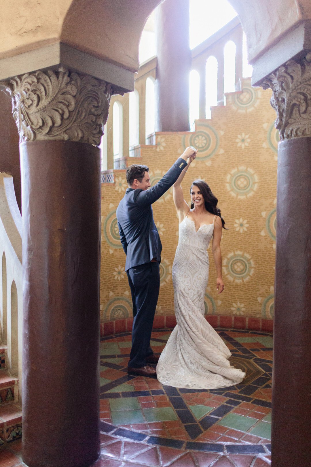 www.santabarbarawedding.com | Kaitie Brainerd | Santa Barbara Courthouse | Blush by Hayley Paige | Indochino | Bride and Groom Share a Moment at the Courthouse