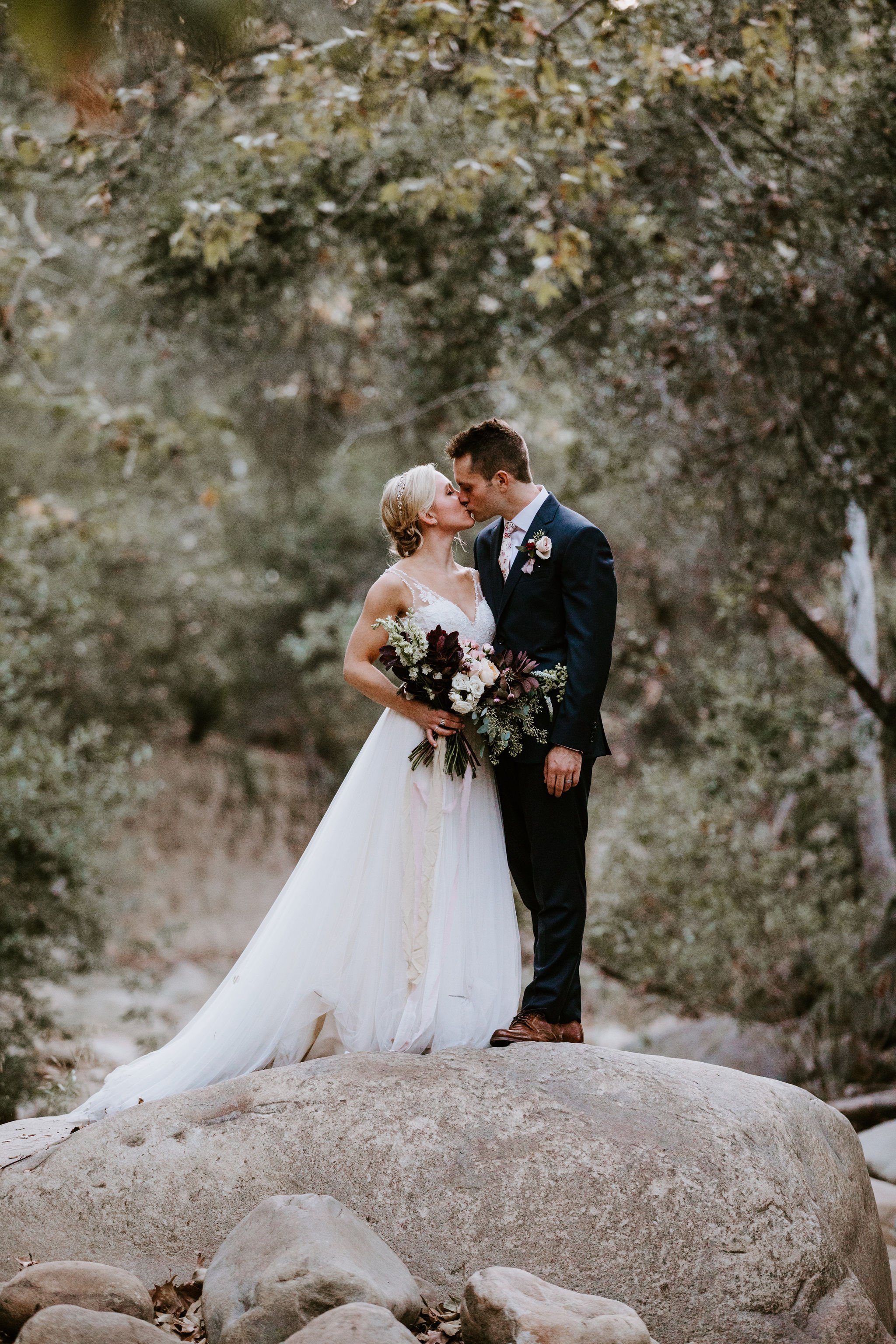 www.santabarbarawedding.com | Geoff and Lyndsi Photography | Santa Barbara Museum of Natural History | Jamie Mangone of LuJane Events | Topa Flora | Bride and Groom Share a Kiss