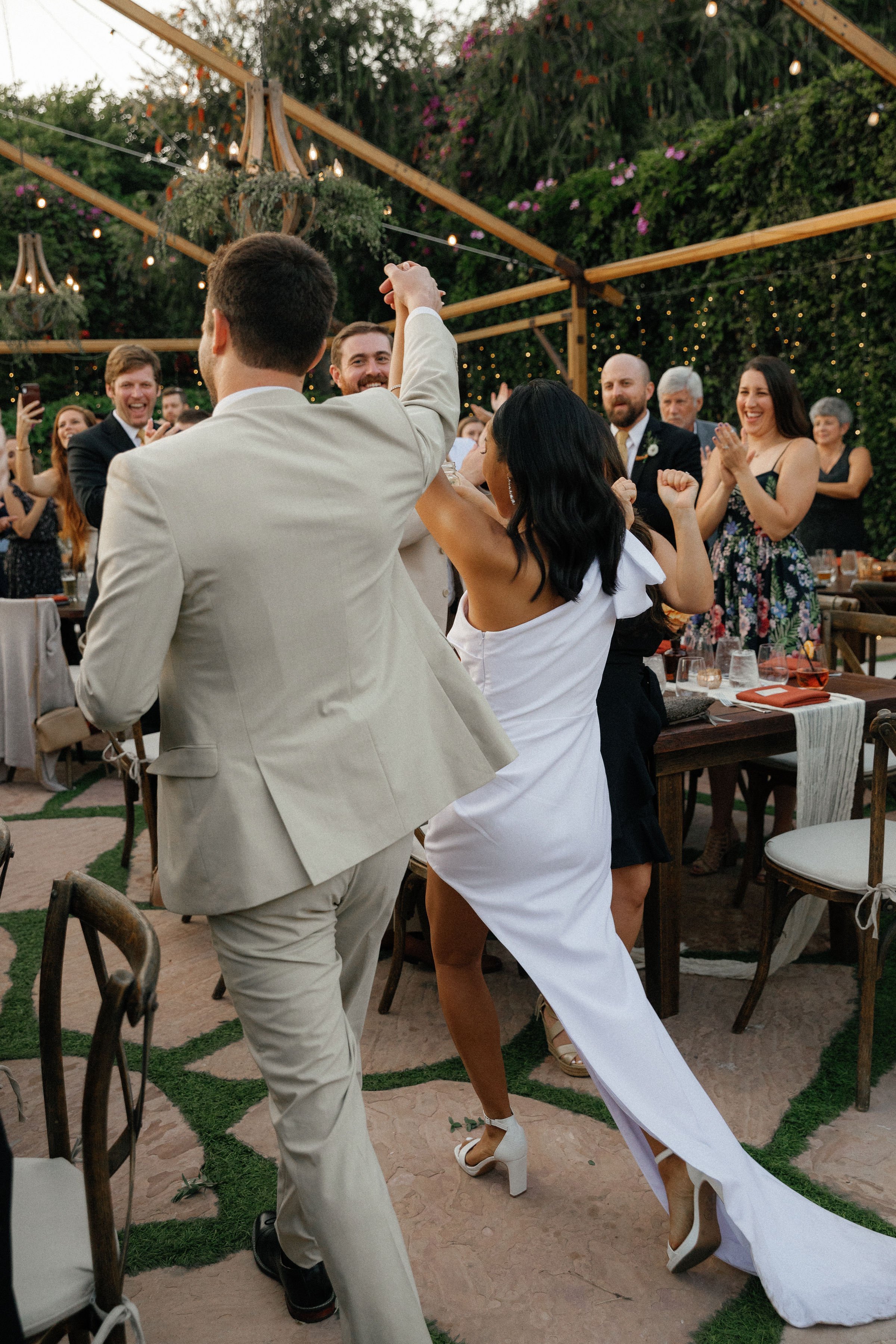 www.santabarbarawedding.com | Rincon Beach Club | Rachel Wakefield | PacWest Blooms | 805 Makeup | Samantha Wagner | Couple Walking Into Reception 