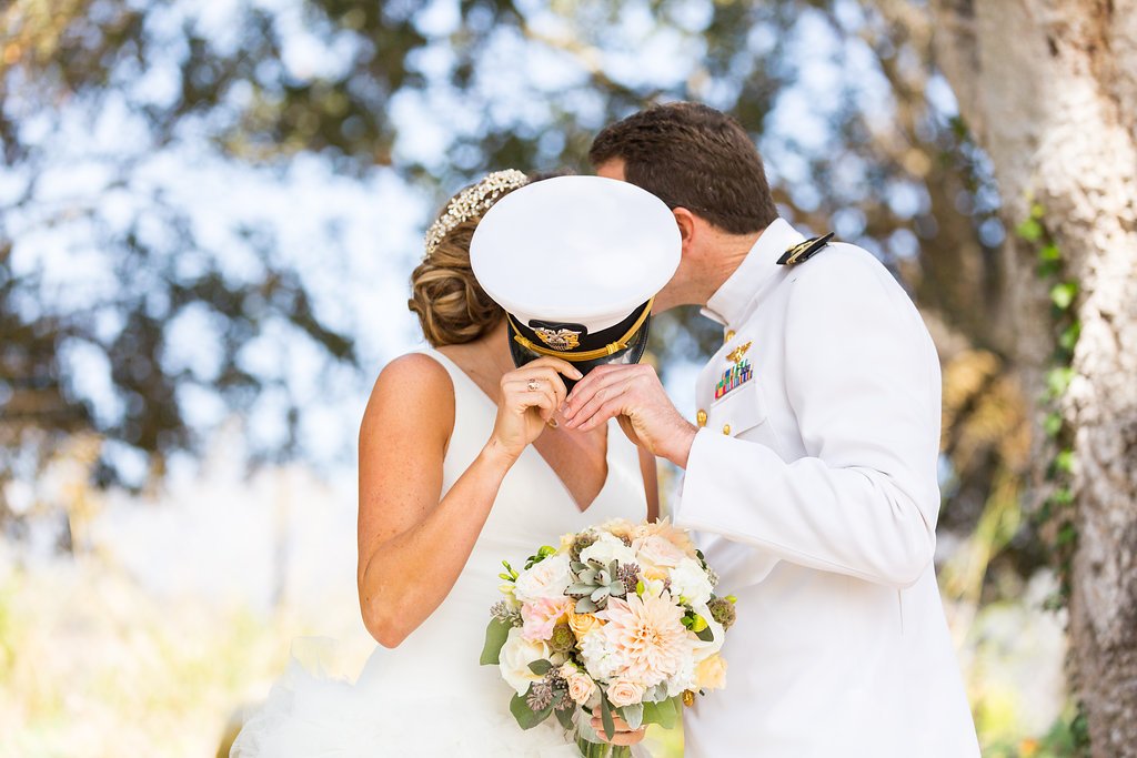 www.santabarbarawedding.com | Anna Schmidt Photography | Heartstone Ranch | Grass Roots | Pure Joy Catering | Bride and Groom Behind His Navy Hat