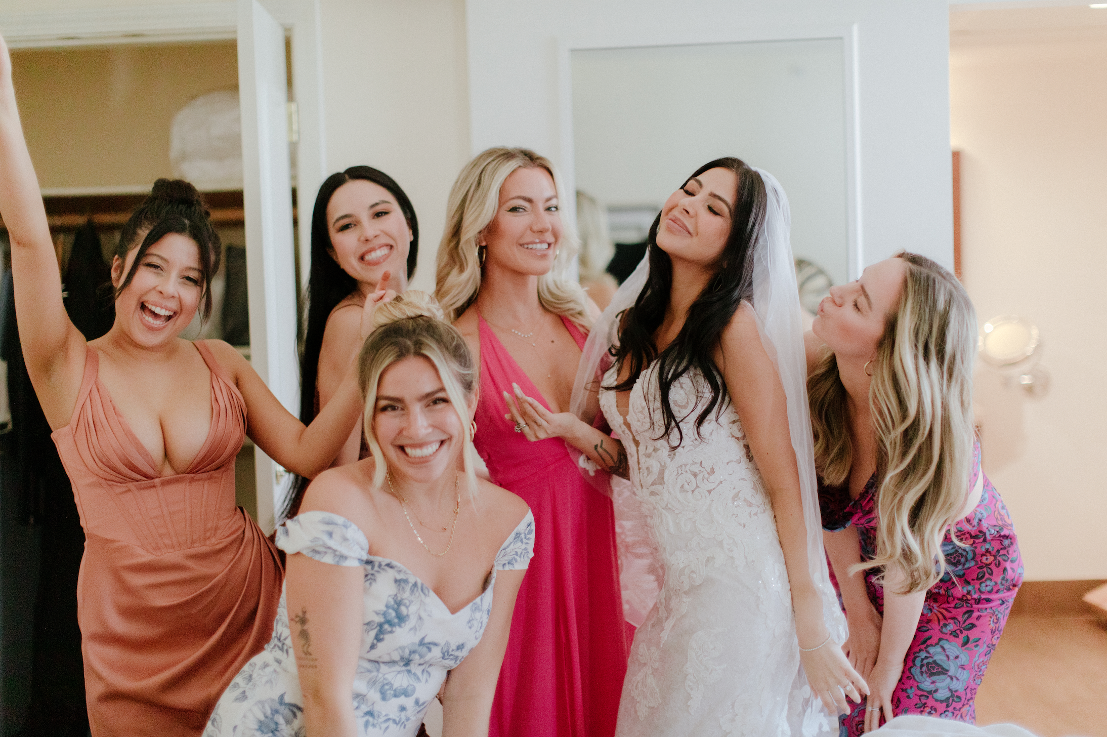 www.santabarbarawedding.com | Chris J. Evans | Santa Barbara Courthouse | Anita’s Bridal | Bride with Her Bridesmaids in a Range of Colors Before the Ceremony 