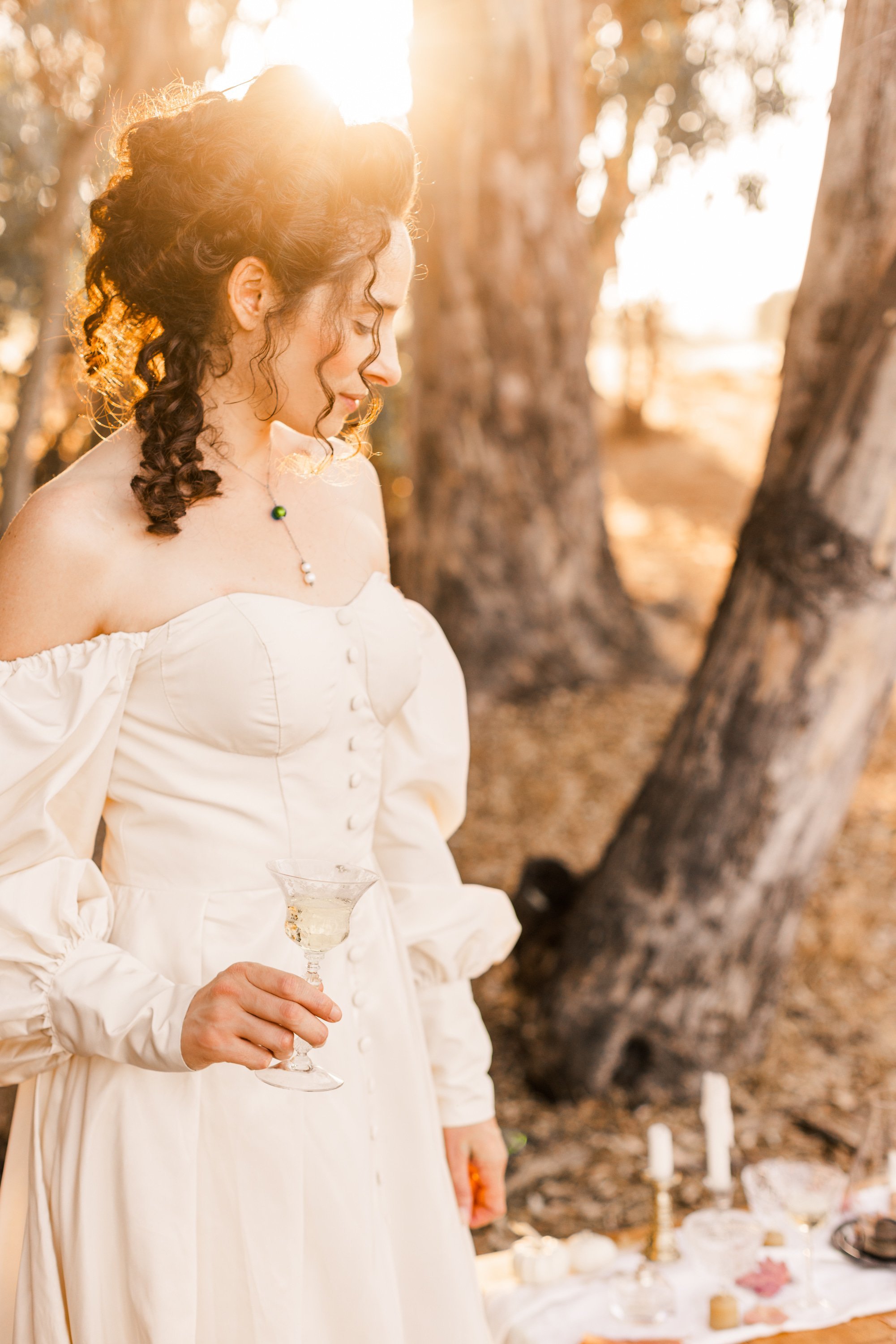 www.santabarbarawedding.com | Veils &amp; Tails | Trader Joe’s Alpha Thrift | Kelly Rose | Dalliance Gown Rentals | Model Drinking Champagne from a Vintage Cup