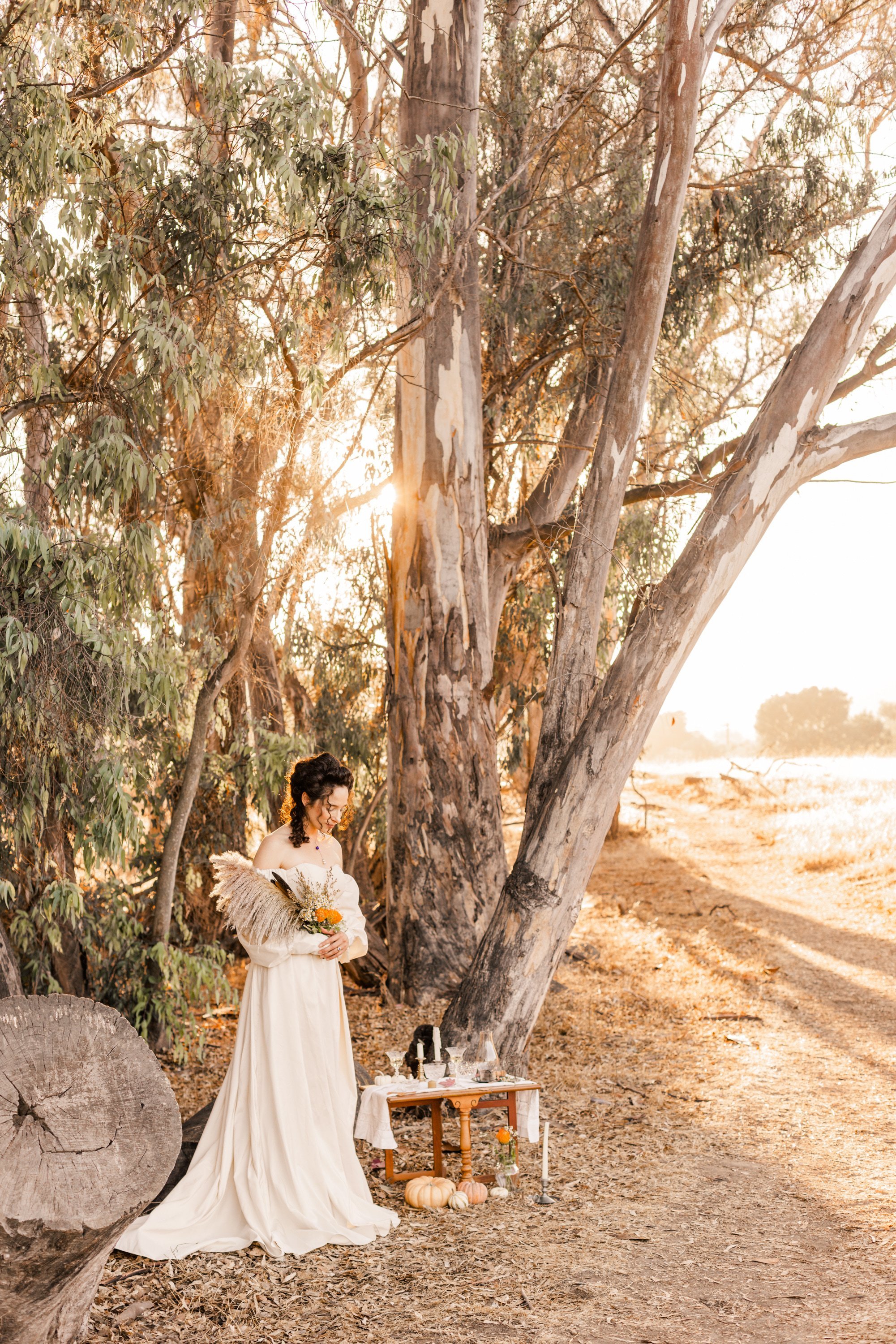 www.santabarbarawedding.com | Veils &amp; Tails | Trader Joe’s Alpha Thrift | Kelly Rose | Dalliance Gown Rentals | Model Holding Autumn Floral Arrangement