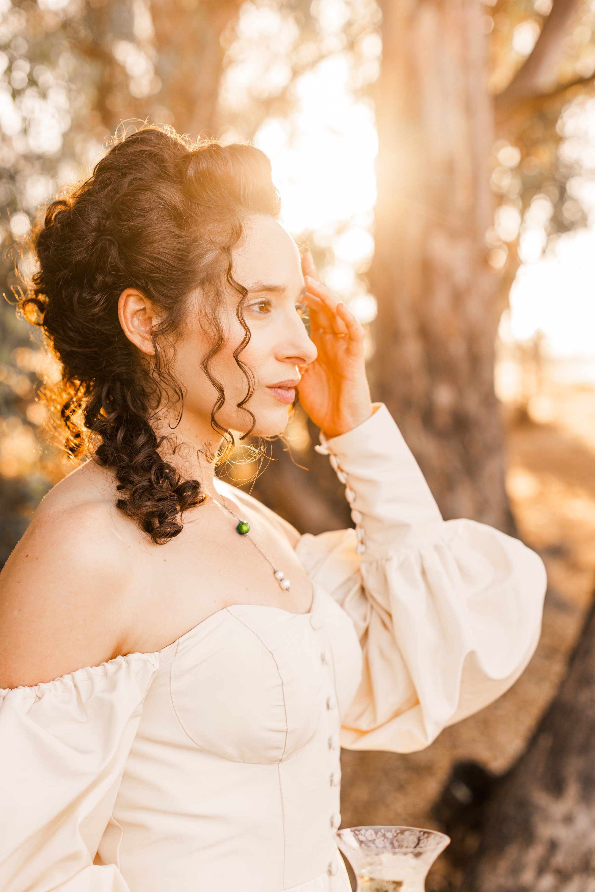www.santabarbarawedding.com | Veils &amp; Tails | Kelly Rose | Dalliance Gown Rentals | Model with the Sun in the Background
