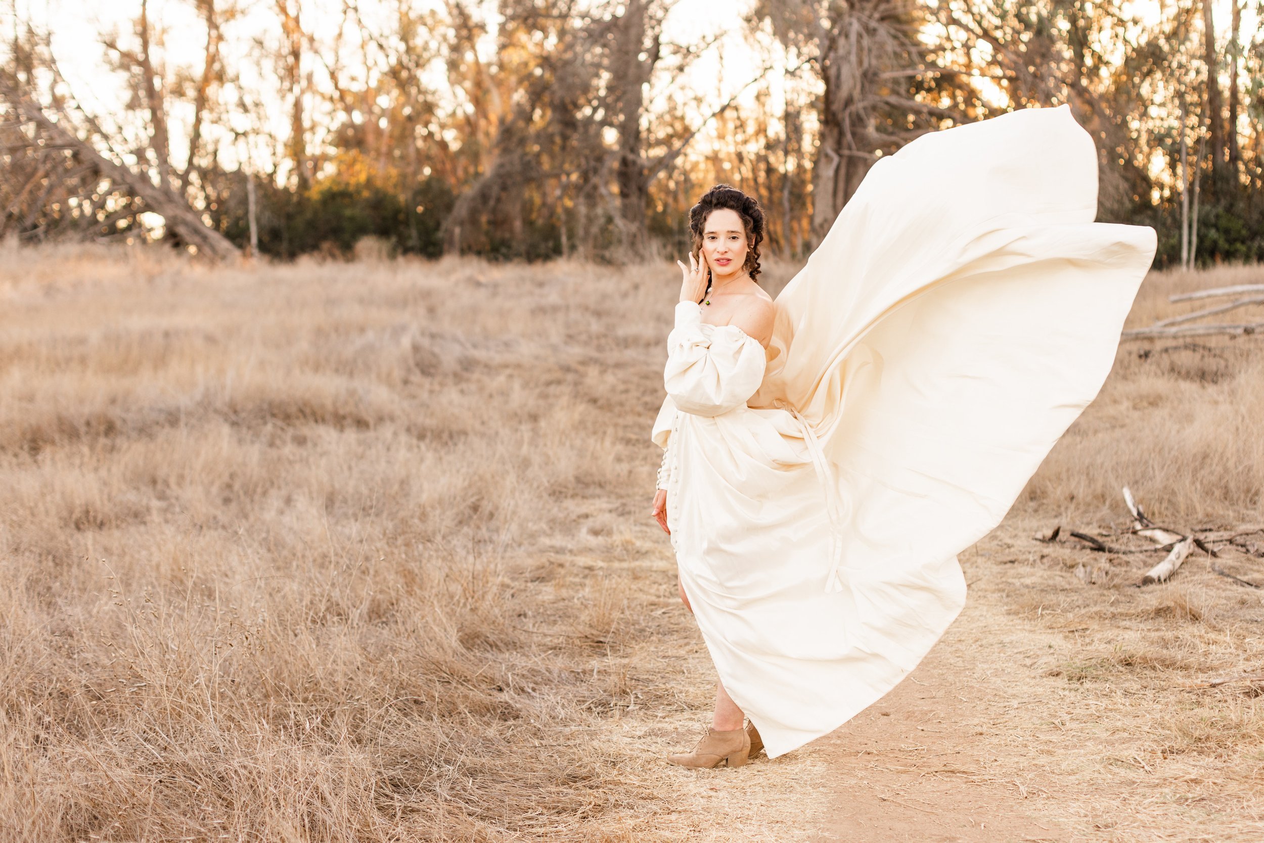 www.santabarbarawedding.com | Veils &amp; Tails | Kelly Rose | Dalliance Gown Rentals | Model with Her Dress Flying in the Wind