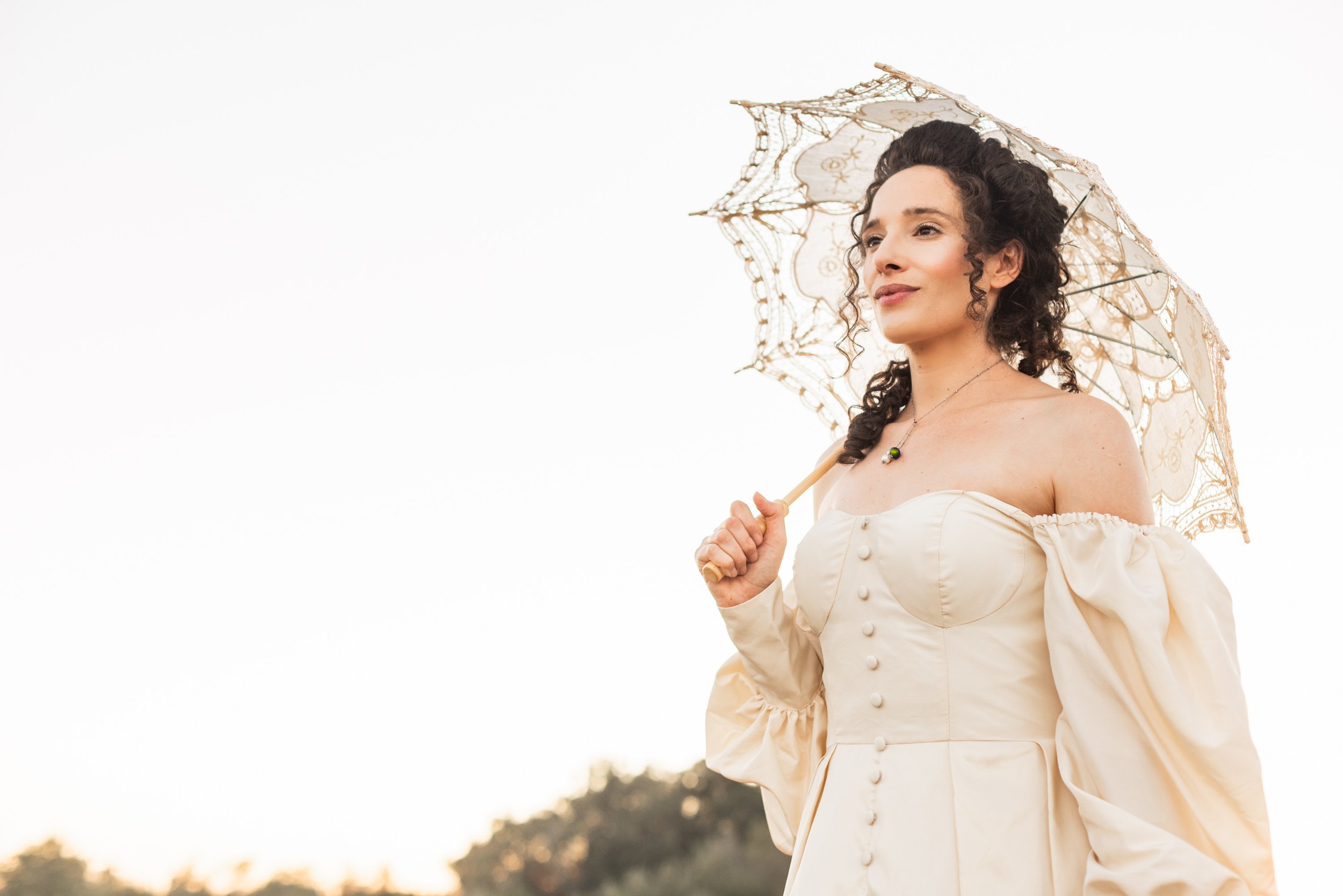 www.santabarbarawedding.com | Veils &amp; Tails | Kelly Rose | Dalliance Gown Rentals | Model Holding a Vintage Umbrella