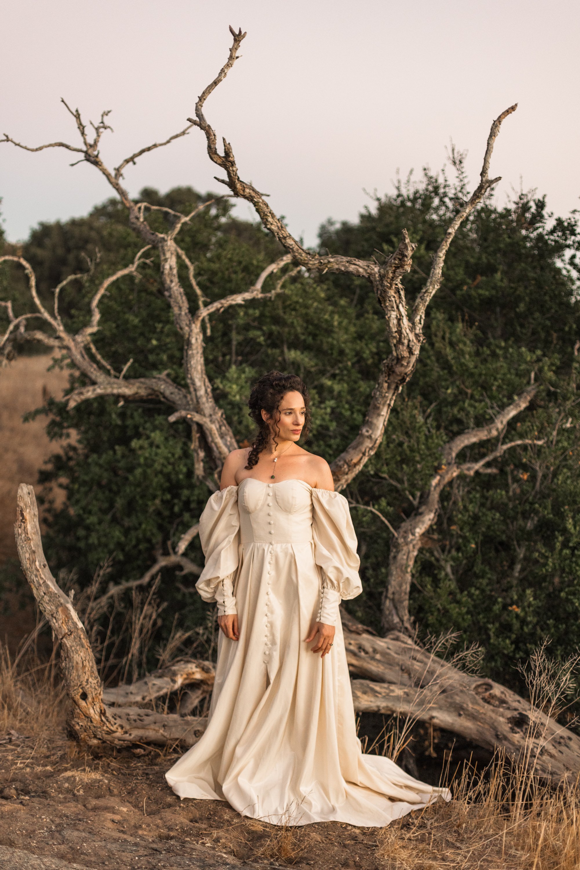 www.santabarbarawedding.com | Veils &amp; Tails | Kelly Rose | Dalliance Gown Rentals | Model in Front of a Fallen Tree