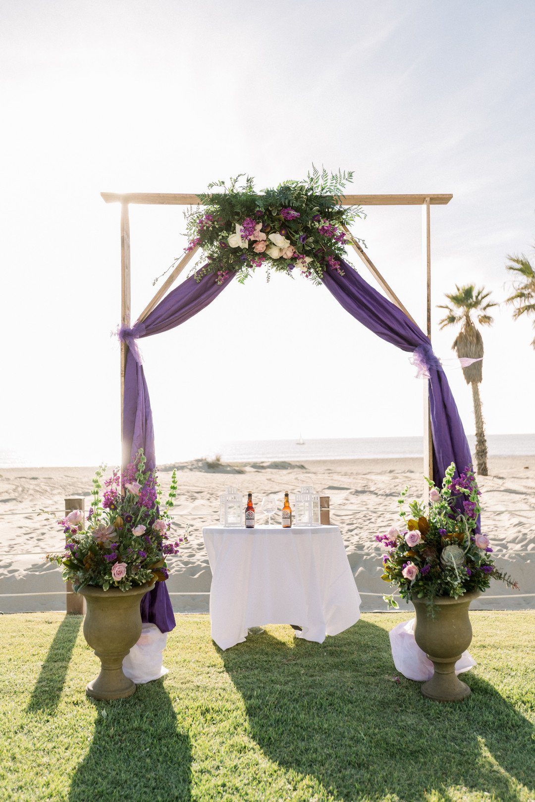 www.santabarbarawedding.com | Three16 Photography | Embassy Suites by Mandalay Beach Resort | One Sweet Day | Conroy’s Flowers | Wedding Arch in Front of the Ocean 