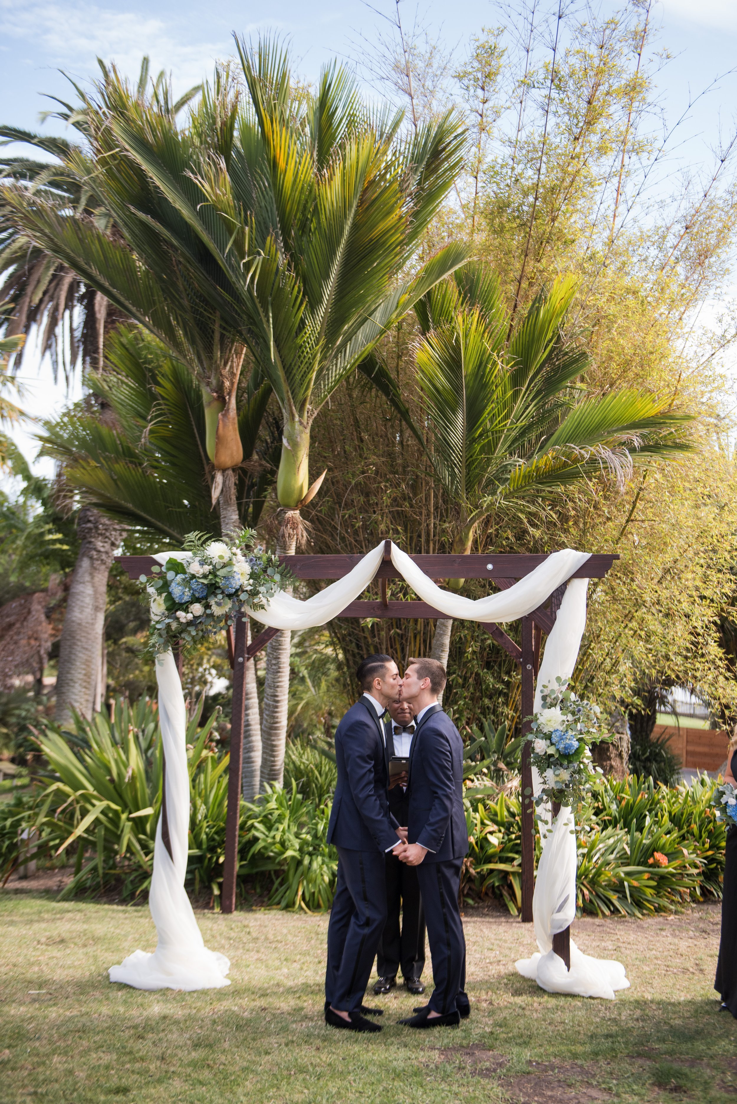www.santabarbarawedding.com | ByCherry Photography | Santa Barbara Zoo | Events by Rincon | Jespersen Flowers | Cartier | Grooms Kissing at the Ceremony 