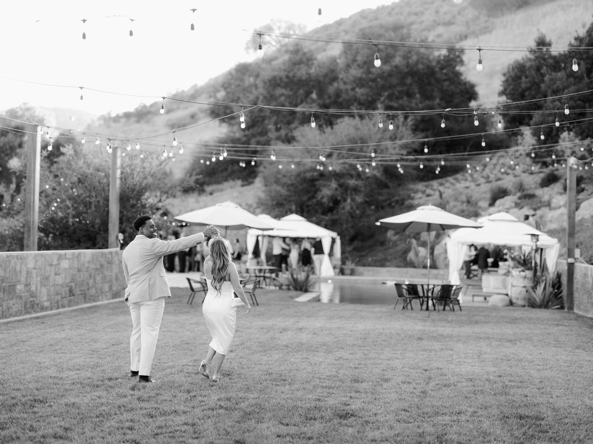 www.santabarbarawedding.com | Zaca Creek | Paul Von Rieter | Lisa Lafferty Events | Glenna Joy Flowers | Theoni Collection | Bride and Groom Twirling on the Grass