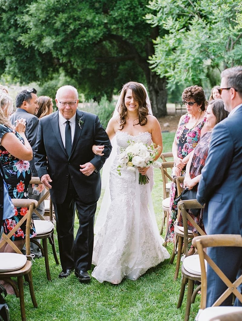 www.santabarbarawedding.com | White Sage | Taryn Grey Photography | Ojala Floral | The Tent Merchant | Otis &amp; Pearl | TEAM Hair &amp; Makeup | Bride Walking Down the Aisle with Her Dad