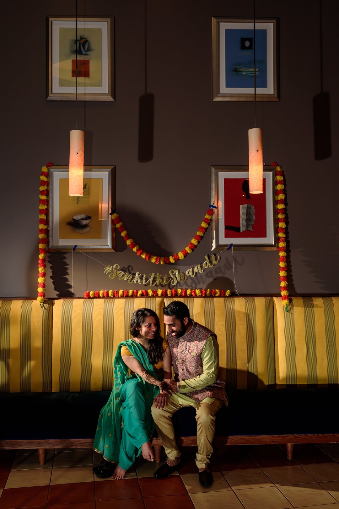 www.santabarbarawedding.com | Hilton SB | Blue Lotus Insights | Shawna Yamamoto | MPSingh Photography | Couple Embracing on Yellow Couch