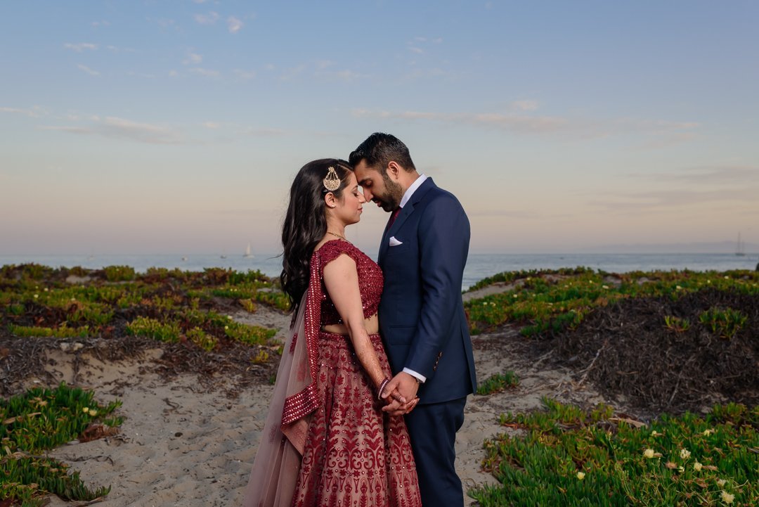 www.santabarbarawedding.com | Hilton SB | Blue Lotus Insights | Shawna Yamamoto | MPSingh Photography | Sari Palace | Michael Andrew BeSpoke | Couple Embracing by the Beach