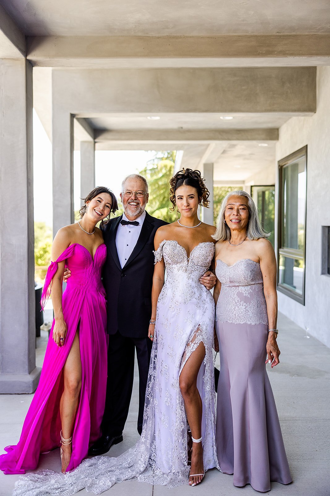 www.santabarbarawedding.com | David Mendoza | Alexis Ireland Florals | TEAM Hair &amp; Makeup | Bride Posing with Her Family Before the Ceremony 