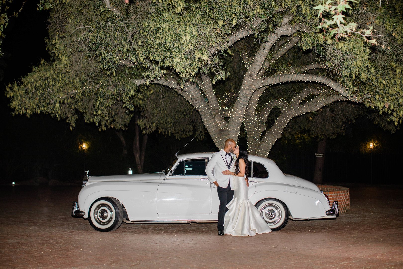 www.santabarbarawedding.com | Amber Jean Photography | Quail Ranch | Lulus | Friar Tux | Classy Chassis | Bride and Groom with a White Rolls Royce 