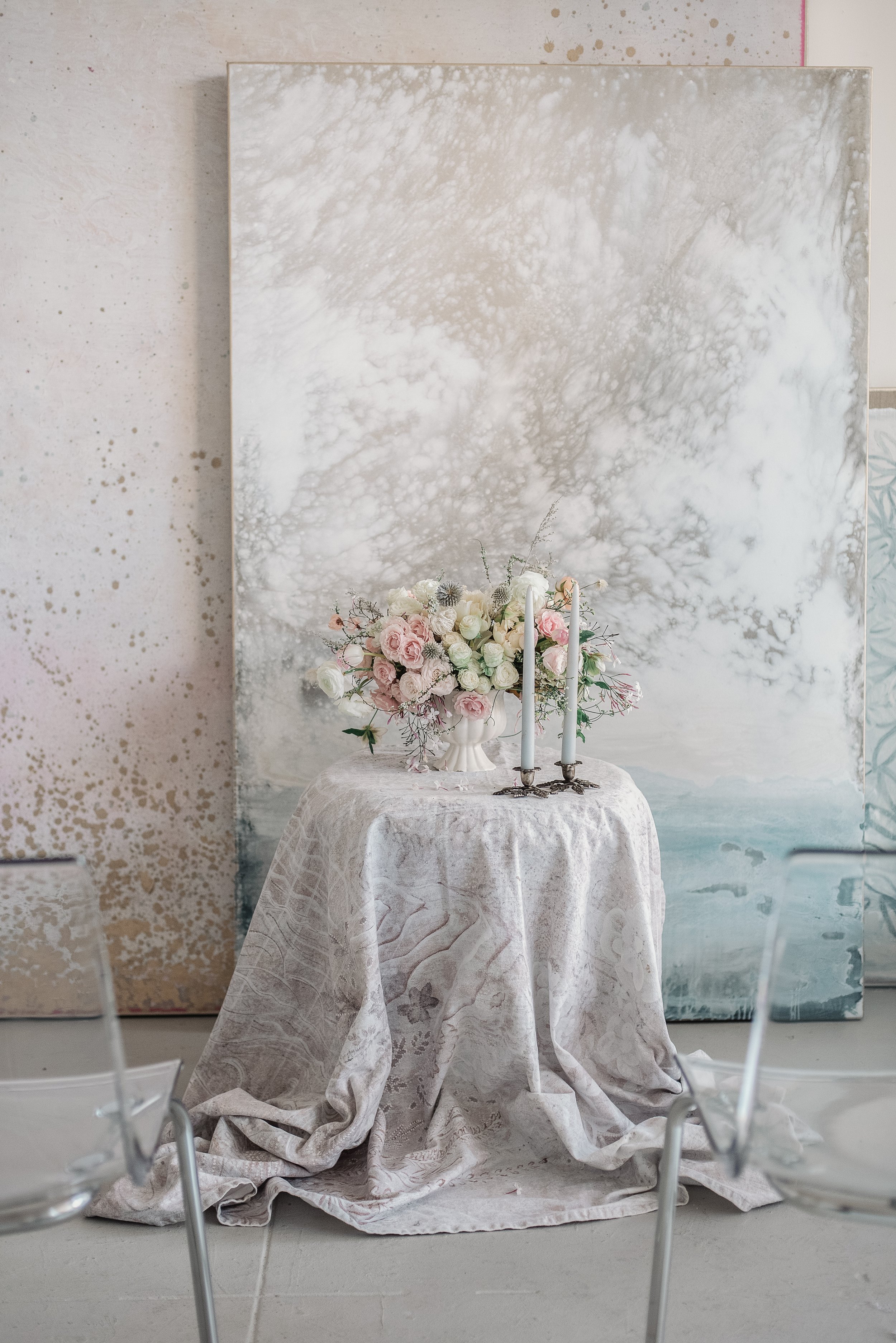 www.santabarbarawedding.com | Meg Sandu | Colette Cosentino Gallery | Margaret Joan Florals | Reception Table in Front of Large Paintings