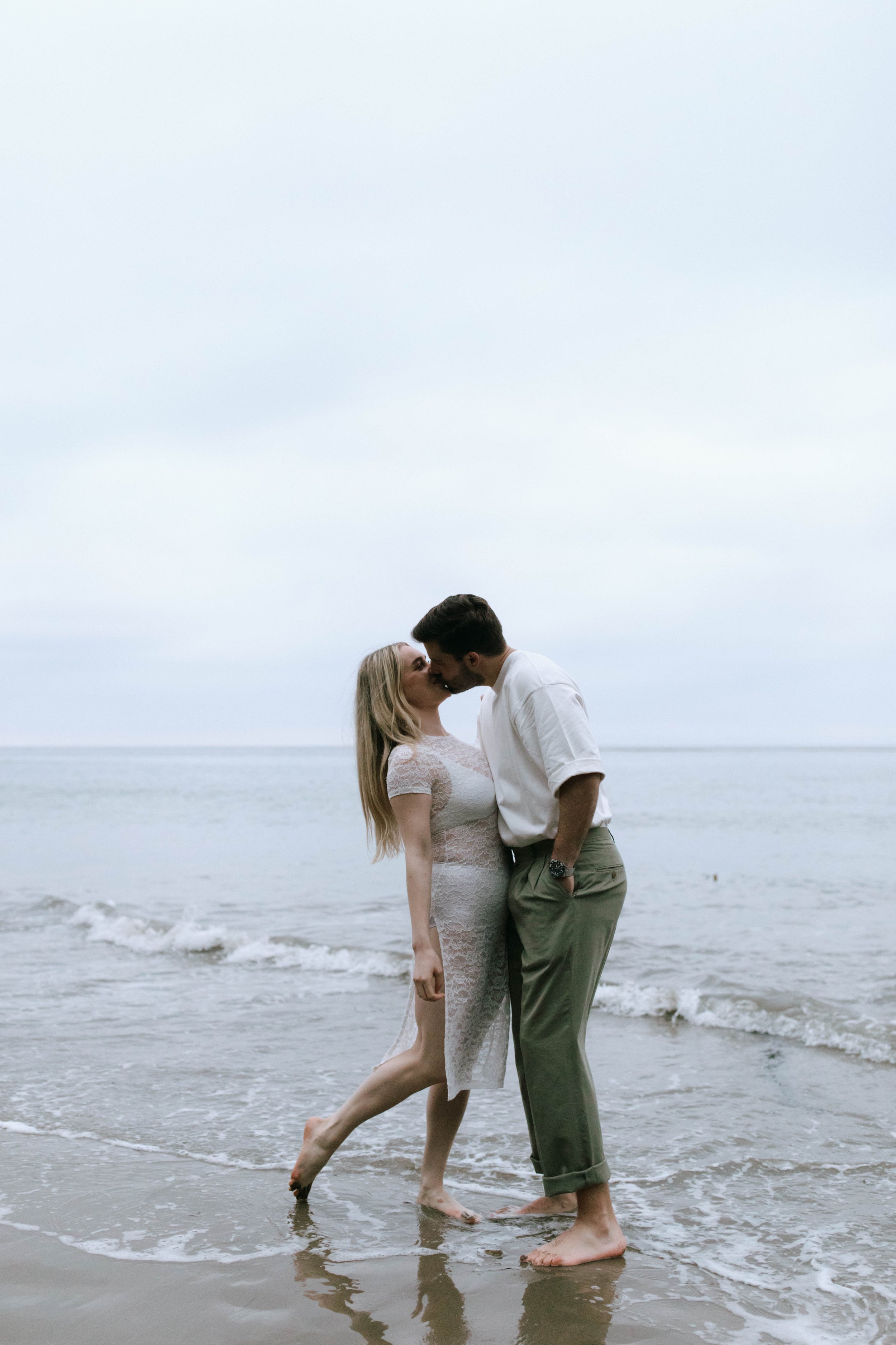 www.santabarbarawedding.com | Monique Bianca Photography | Santa Barbara Beach | Rotate | Couple Kissing on the Beach