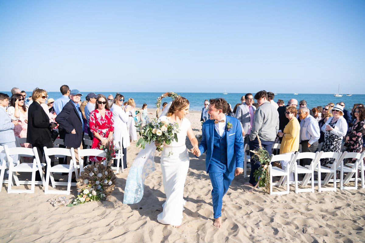 www.santabarbarawedding.com | Peterson Design &amp; Photography | Bride and Groom Leaving Their Beach Ceremony 
