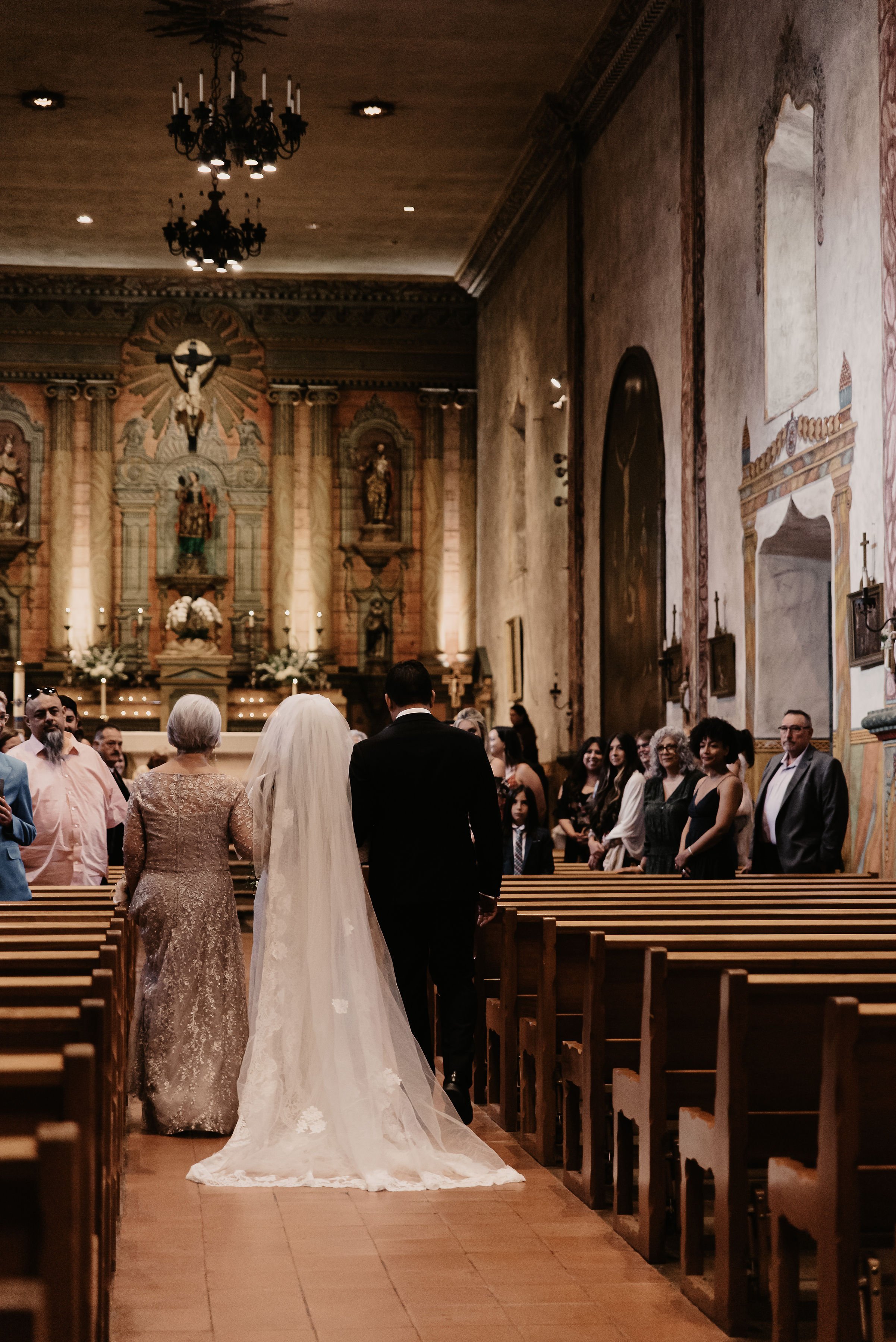 www.santabarbarawedding.com | Staci Hood | Old Mission SB | Flowers for Love | Kelly Novobielski | Emily Lynn and Company | Grace Loves Lace | Fr. Dan Lackie | Bride Walking Down Aisle