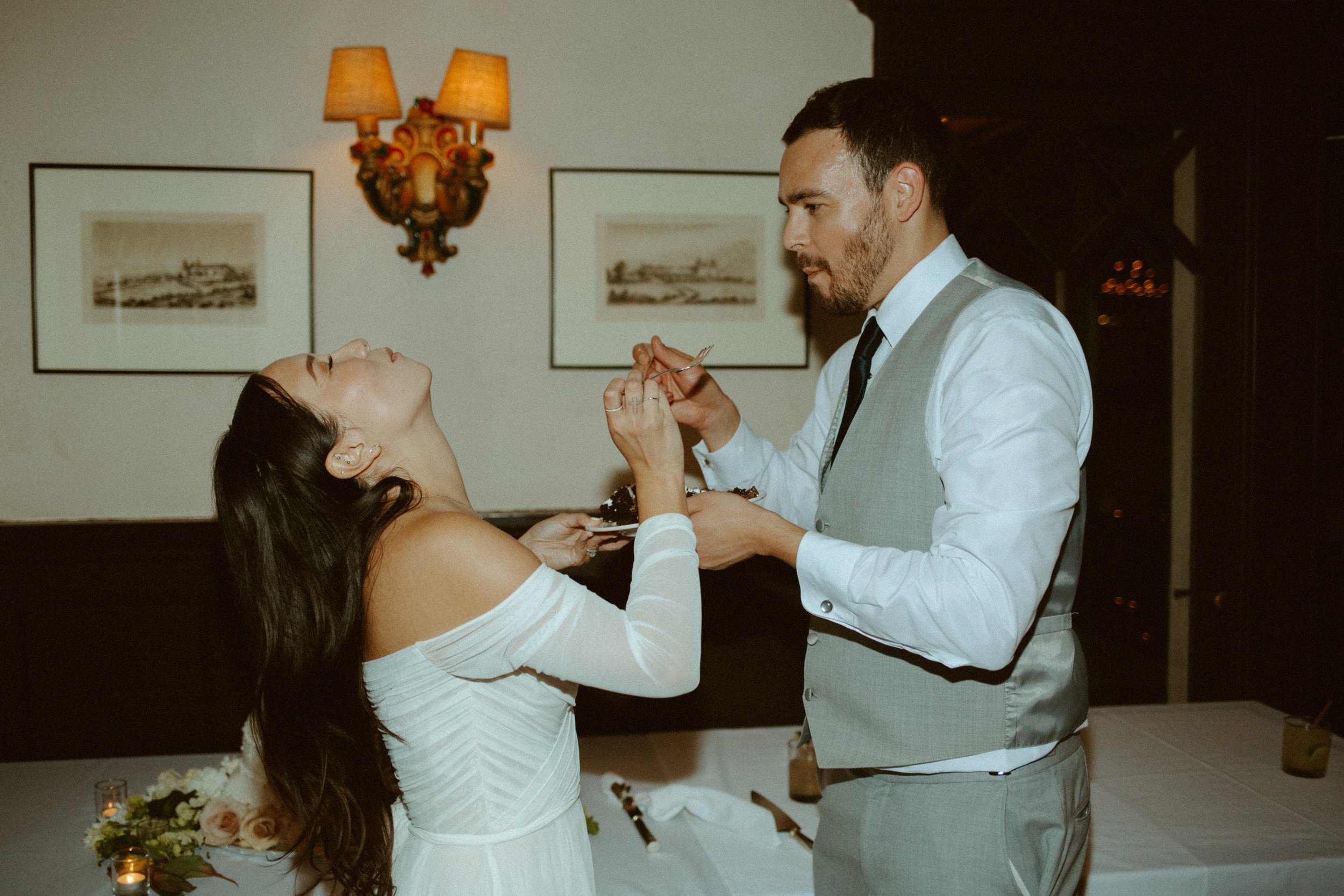 www.santabarbarawedding.com | Mallory Carlson | Santa Barbara Club | Events by Tiffany J | Antheia Floral &amp; Design | BHLDN | Men’s Wearhouse | Couple Feeding Each Other Cake 