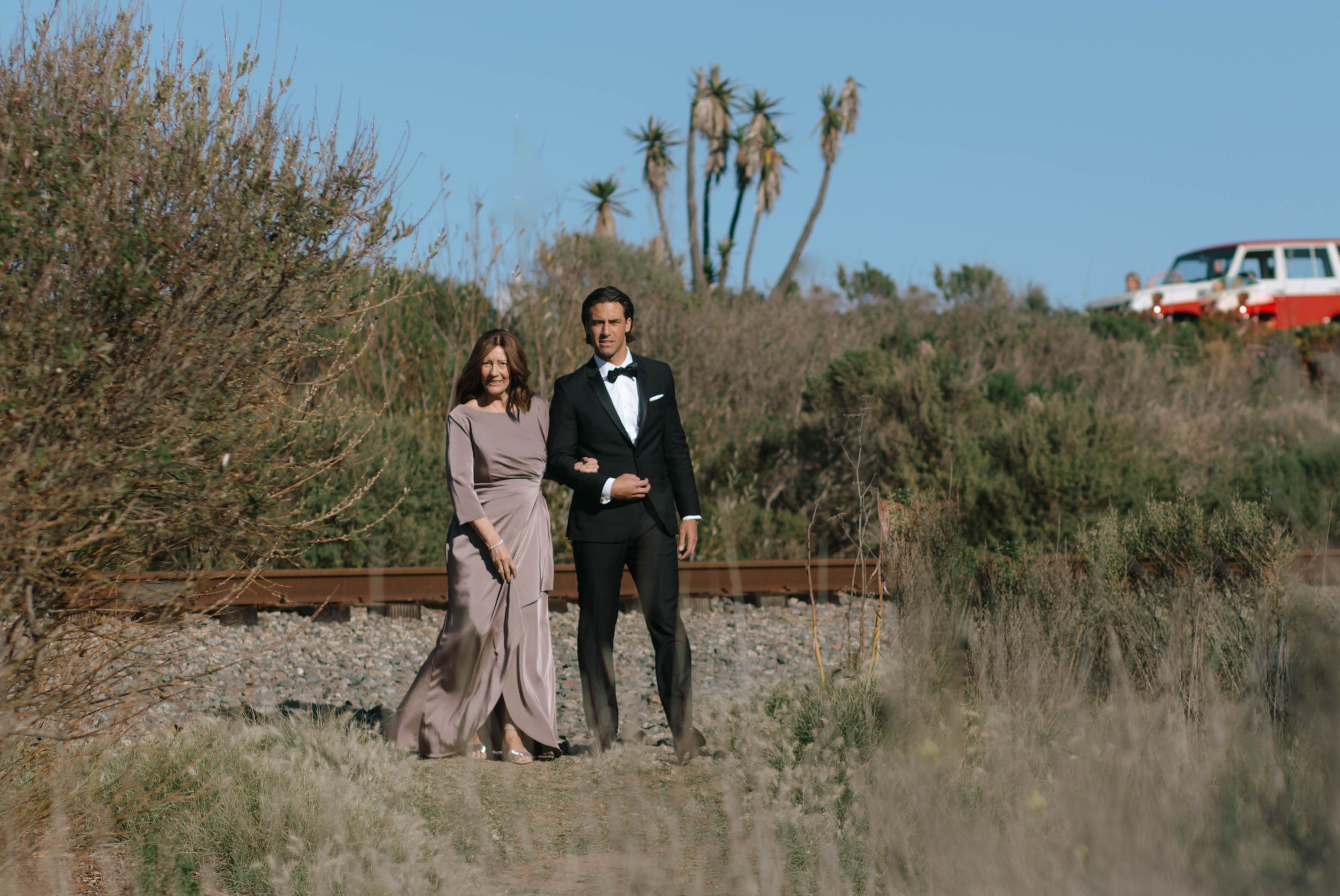 www.santabarbarawedding.com | Monique Biance | Amazing Days Events | Dos Pueblos Orchid Farm | Studio Fleurish | Groom and His Mother Walking Into Ceremony 