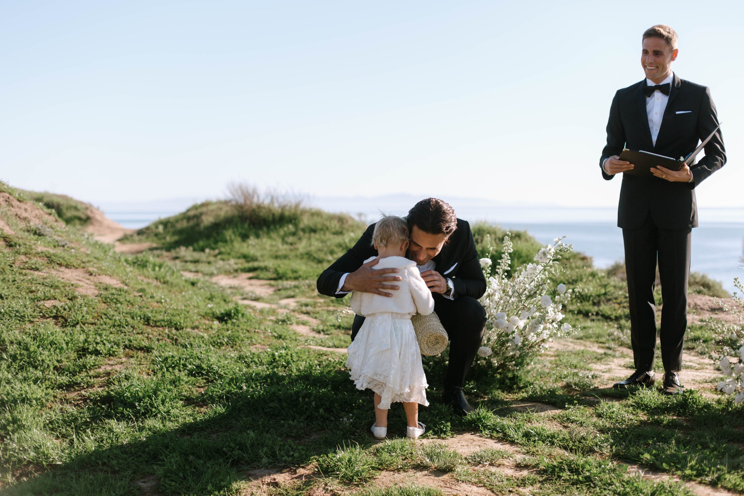 www.santabarbarawedding.com | Monique Biance | Amazing Days Events | Dos Pueblos Orchid Farm | Studio Fleurish | Groom Hugging the Flower Girl