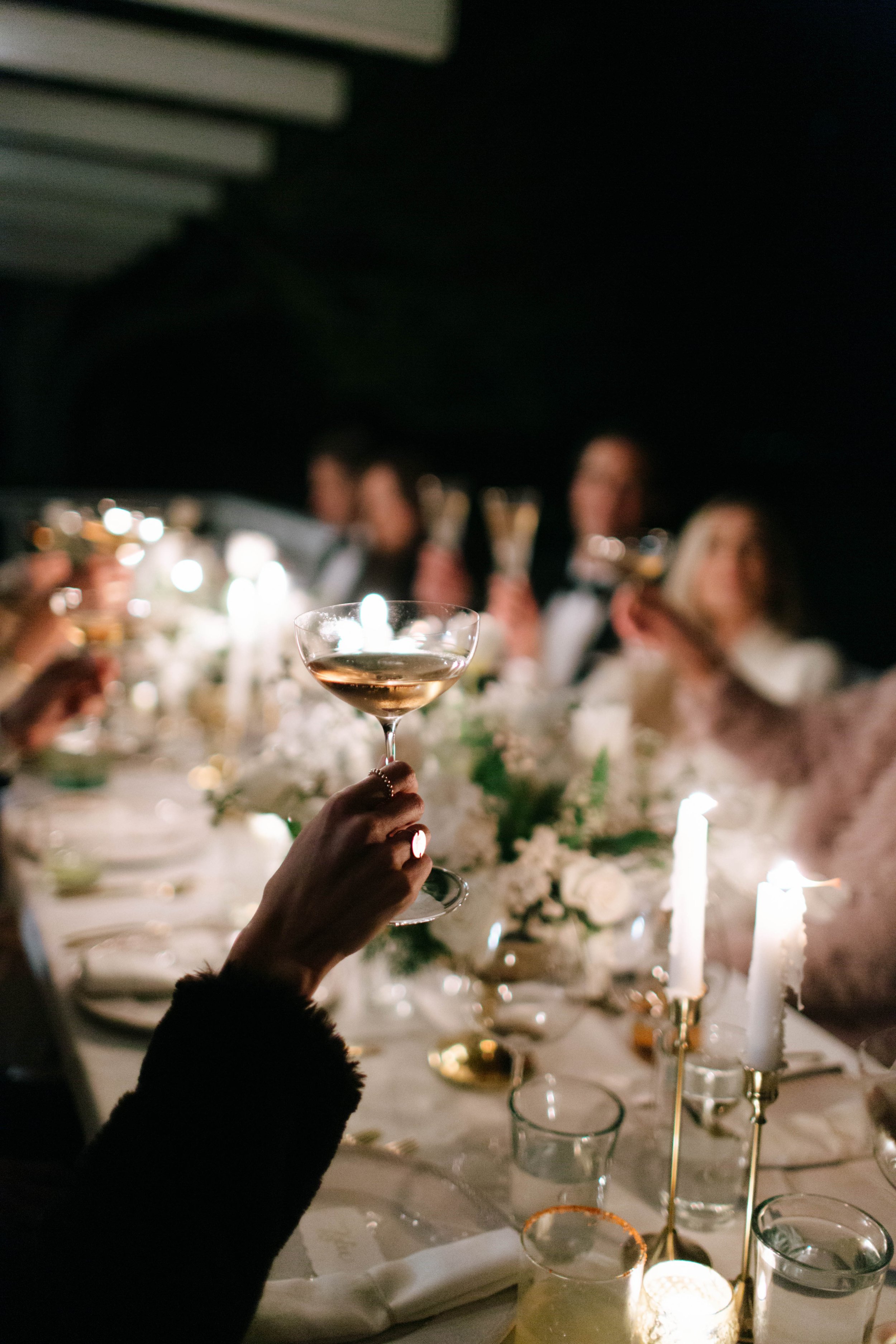 www.santabarbarawedding.com | Monique Biance | Amazing Days Events | Dos Pueblos Orchid Farm | Studio Fleurish | Guest Raising a Glass at the Reception Table 