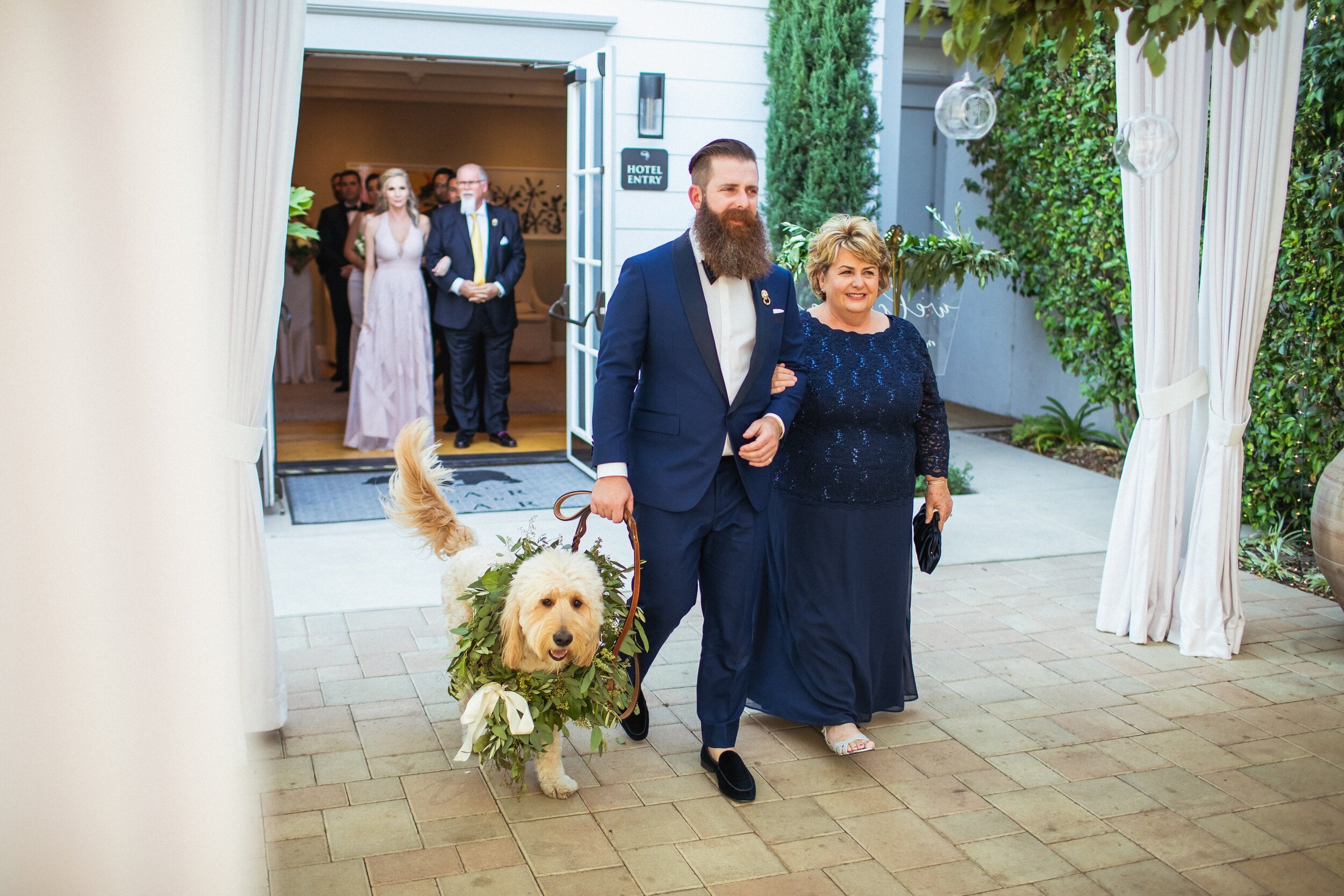 www.santabarbarawedding.com | Montana Dennis Photography | Groom Walking Down the Aisle with His Mom and Dog