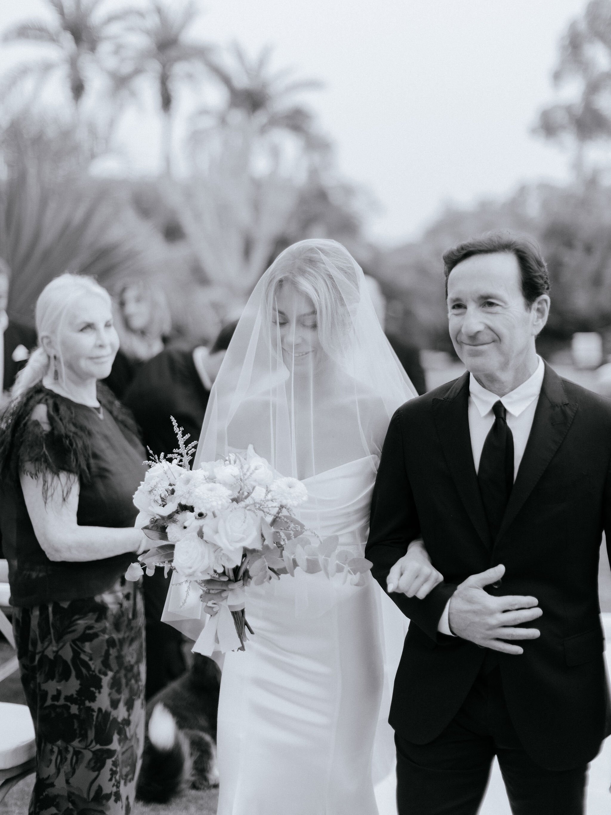 www.santabarbaraweddings.com | Chris J. Evans | Private Residence | Ashley Chanel Events | Rogue &amp; Fox | The Makeup Papi | Bride Walking Down the Aisle with Her Father